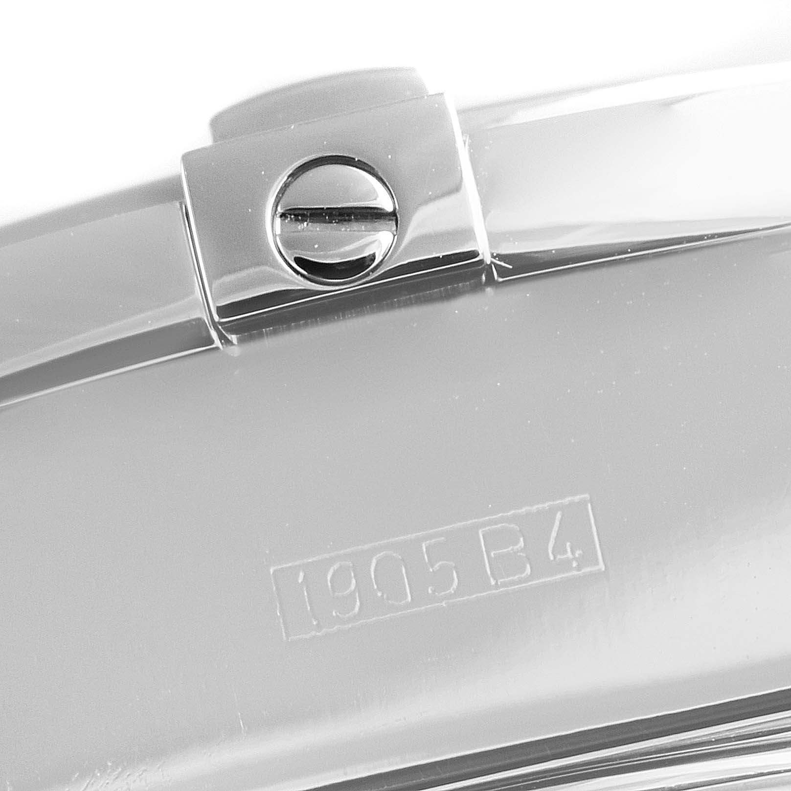 The image shows a close-up of a screw and the engraved identification code on the clasp of a Breitling Chronomat A13356 Men's Stainless Steel Silver Dial A13356 Men's Stainless Steel Silver Dial watch.