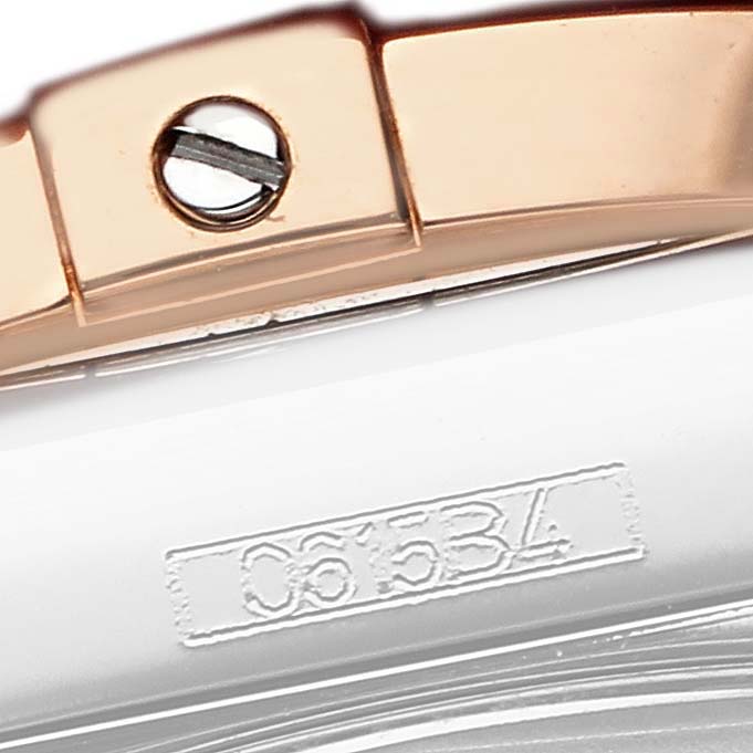 The image shows a close-up of the case edge and bezel screw of a Breitling Galactic C37330 Men
s Steel and Gold (two tone) Mother of Pearl Dial watch.