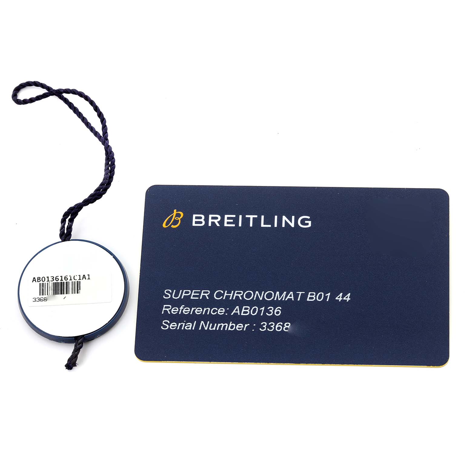 The image shows the certification card and tag for a Breitling Super Chronomat B01 44 watch.