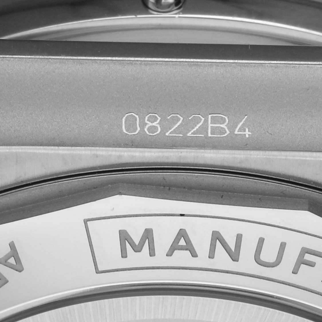 The image shows the side view of a Breitling Chronomat AB0136 Men's Stainless Steel Blue Dial AB0136 Men's Stainless Steel Blue Dial case with engraving details.