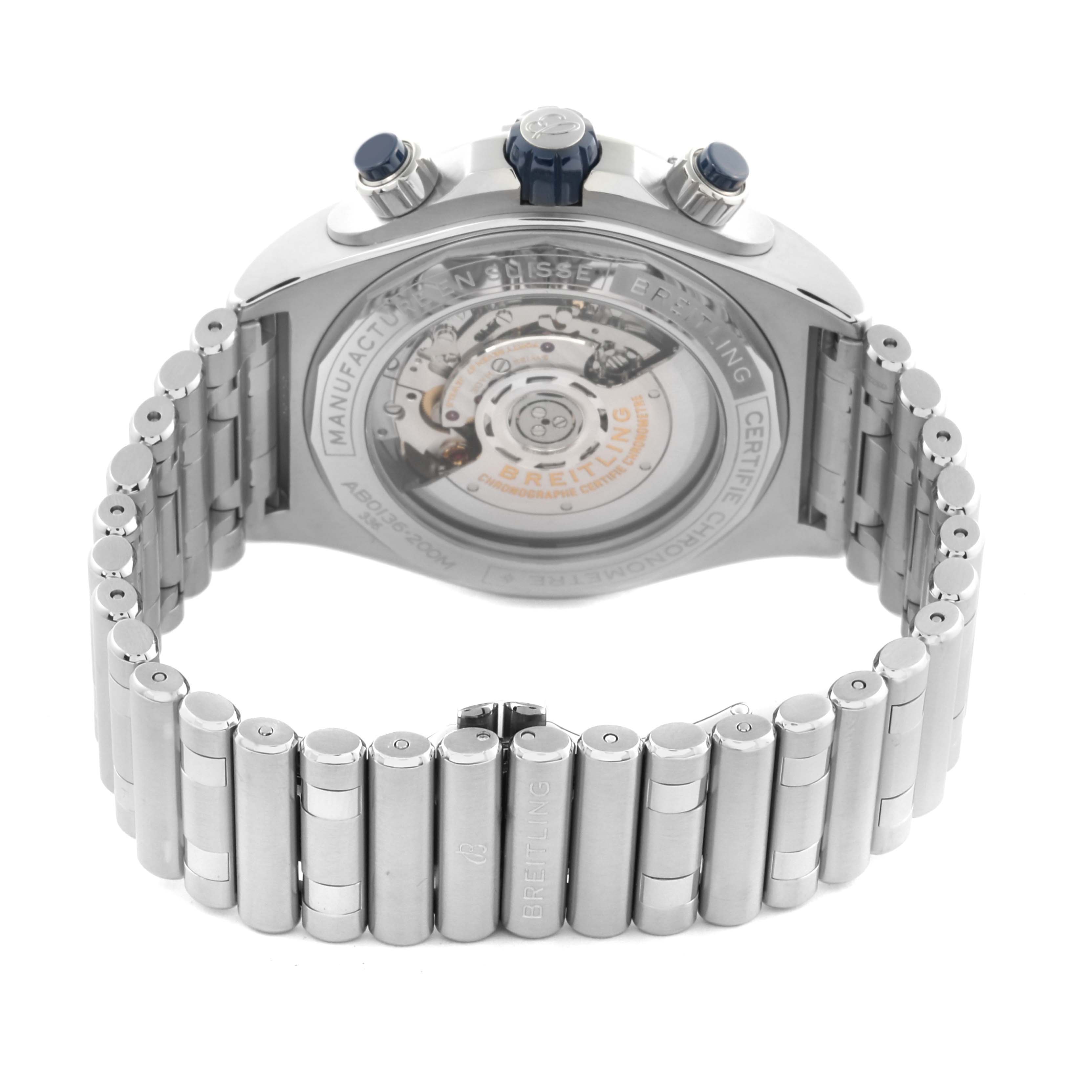 The image shows the back of a Breitling Chronomat AB0136 Men's Stainless Steel Blue Dial AB0136 Men's Stainless Steel Blue Dial watch, highlighting its transparent case back and metal bracelet.