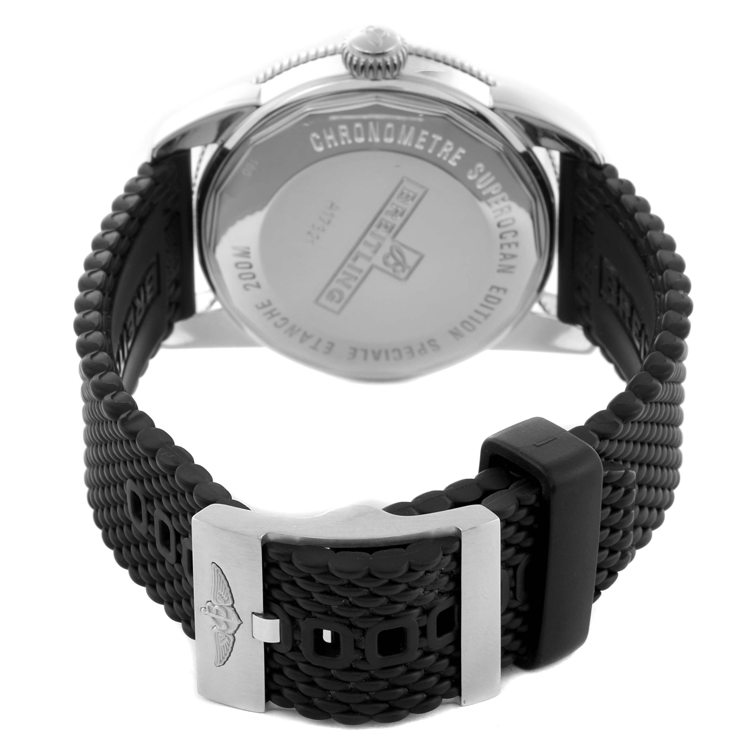 The image shows the back of the Breitling Superocean A17321 Men
s Stainless Steel Silver Dial A17321 Men
s Stainless Steel Silver Dial watch and its textured strap, focusing on the clasp and case back details.