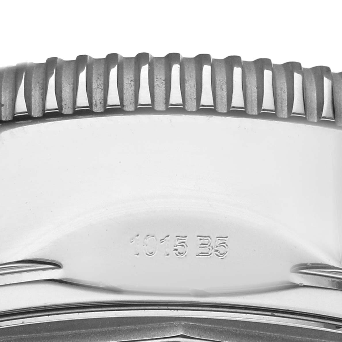 The image shows the side view of a Breitling Superocean A23370 Men
s Stainless Steel Black Dial A23370 Men
s Stainless Steel Black Dial watch case, highlighting the textured bezel and part of the case with engravings.