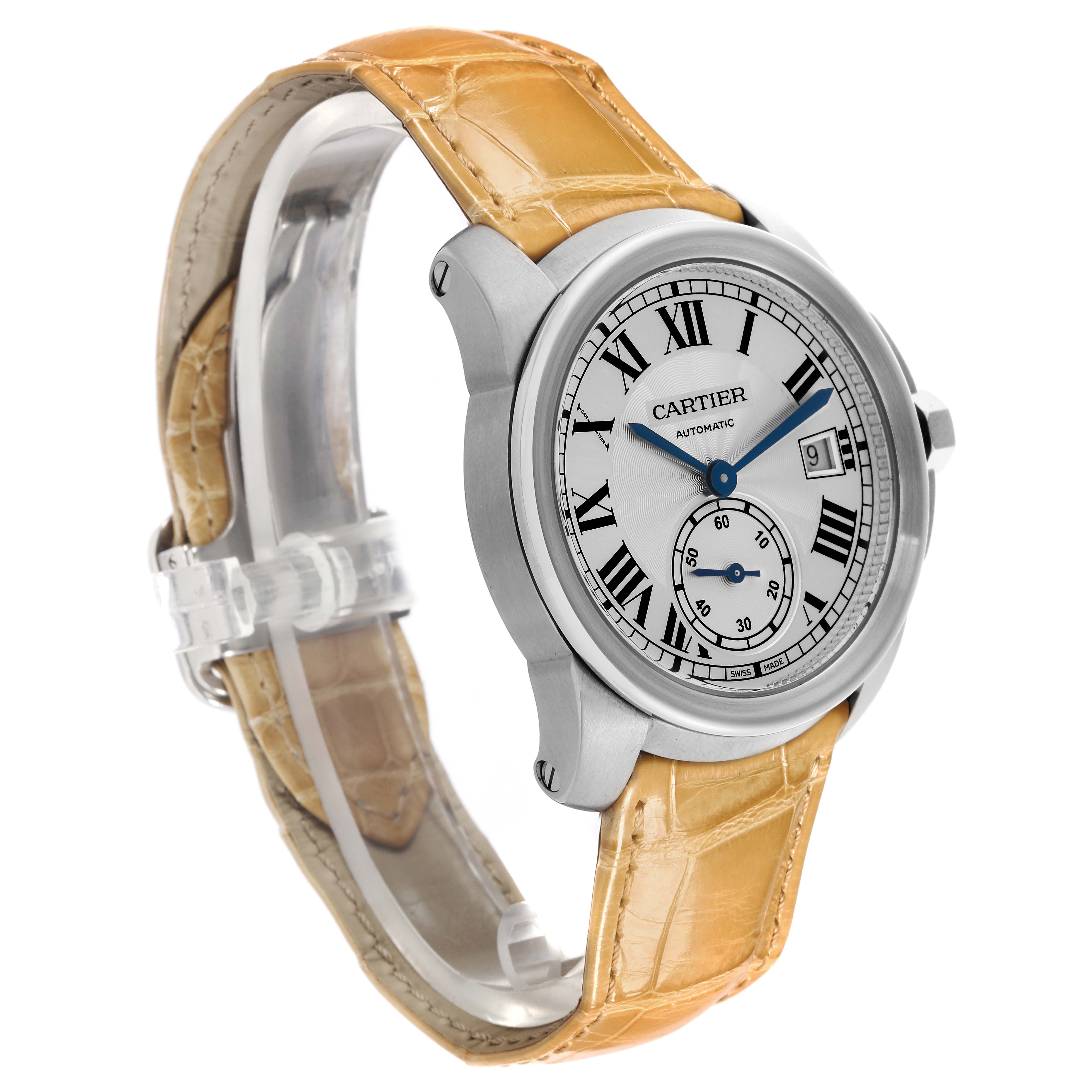 The Calibre de Cartier watch is shown at a side angle displaying the dial, case, and leather strap.