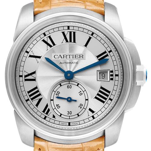 The Calibre de Cartier watch is shown from the front, displaying its face, Roman numerals, hands, sub-dial, and date window.