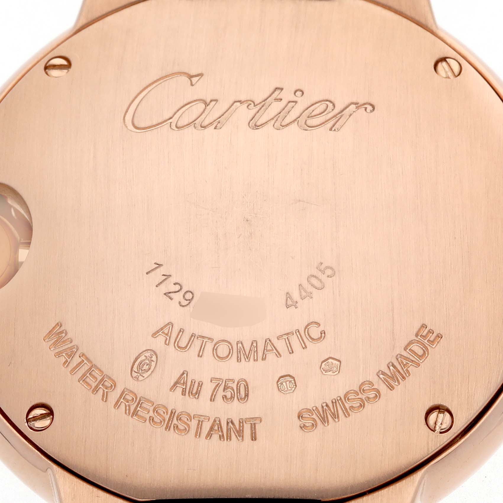 The image shows the back of the Cartier Ballon Bleu WGBB0052 Men
s Rose Gold Silver Dial watch, highlighting engravings and material details.