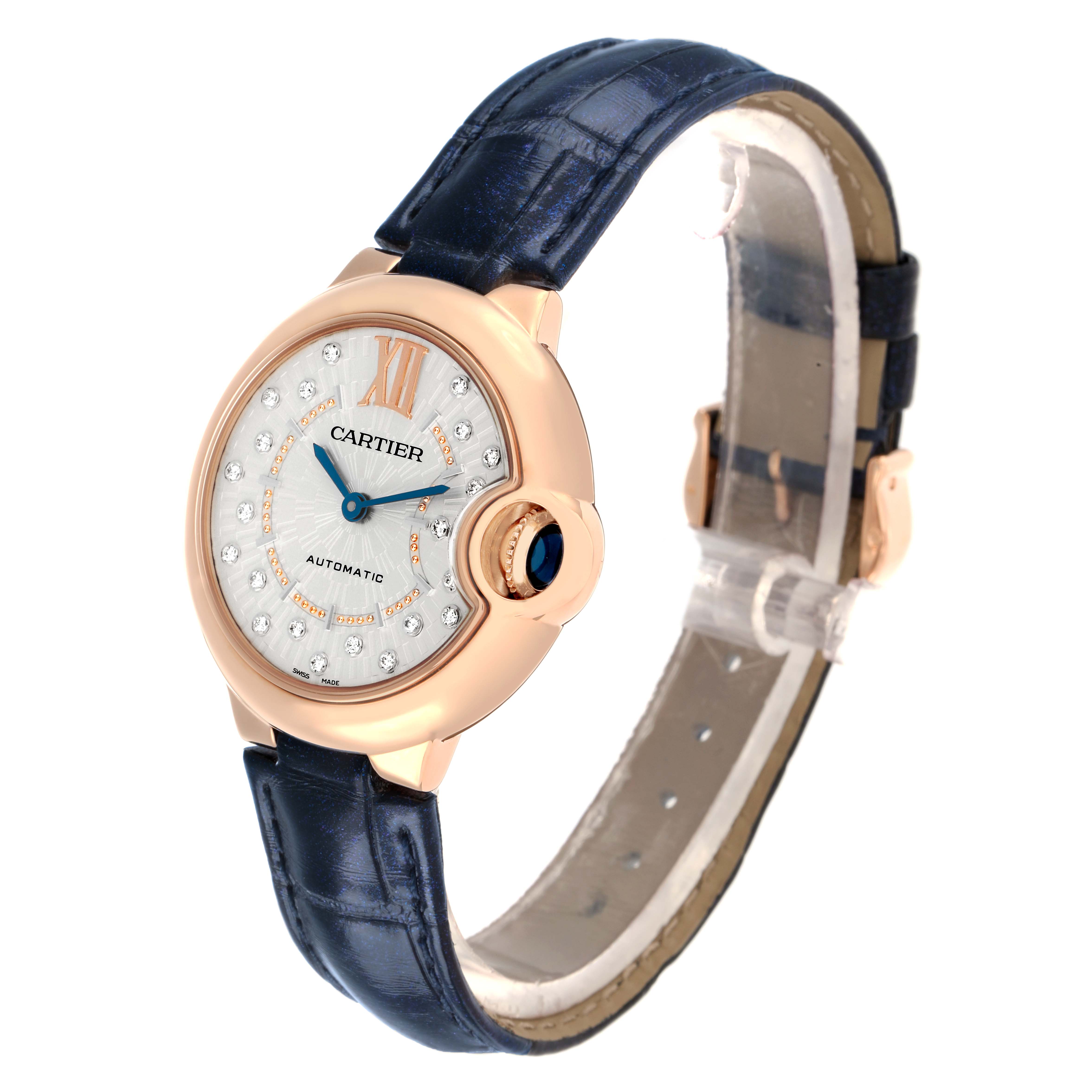 The Cartier Ballon Bleu WGBB0052 Men
s Rose Gold Silver Dial watch is shown at a slight angle, highlighting its face, crown, and leather strap.