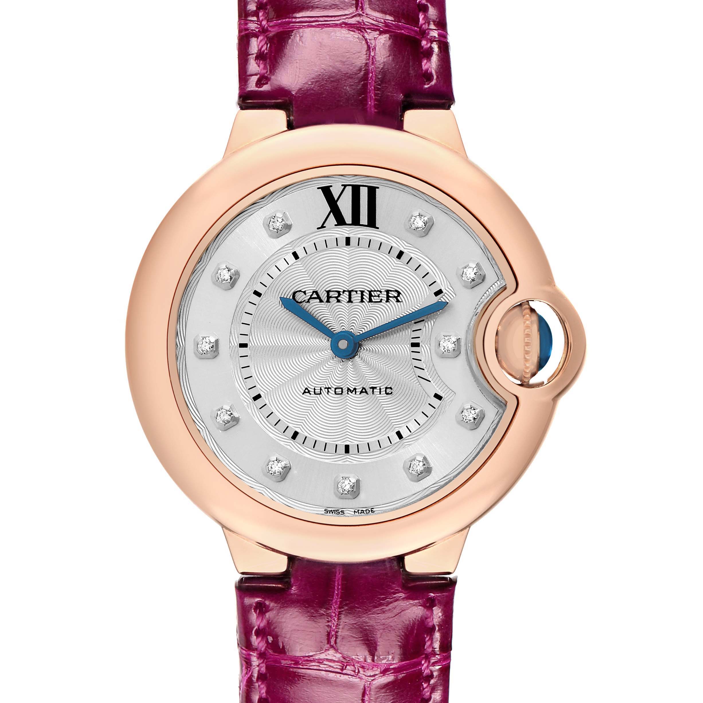 The Cartier Ballon Bleu WE902063 Women
s Rose Gold Silver Dial watch is shown from a front angle, featuring its rose gold case, silver dial with diamond markers, and purple leather strap.