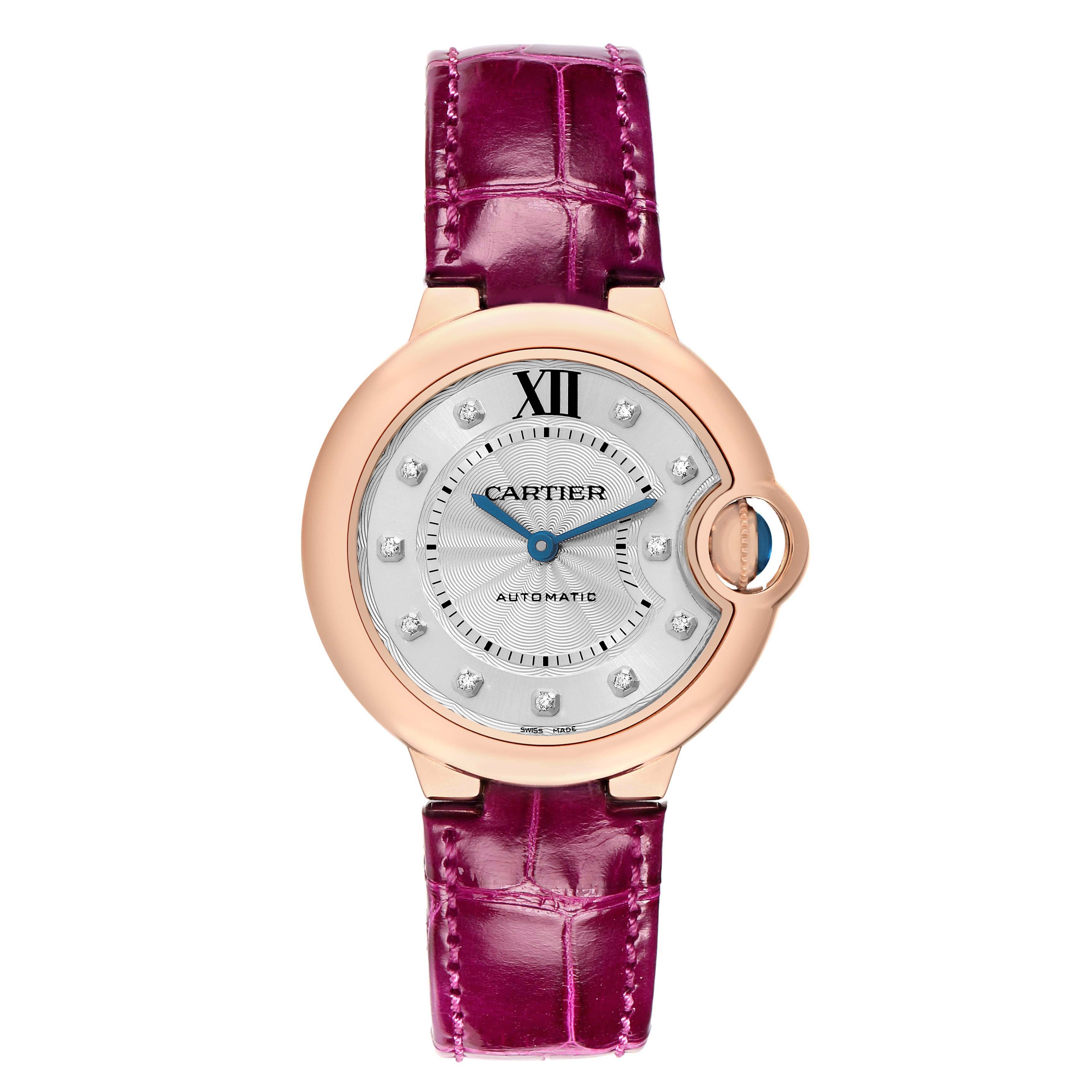 The Cartier Ballon Bleu WE902063 Women
s Rose Gold Silver Dial watch is shown from a front angle, displaying its pink strap, round case, and blue hands.