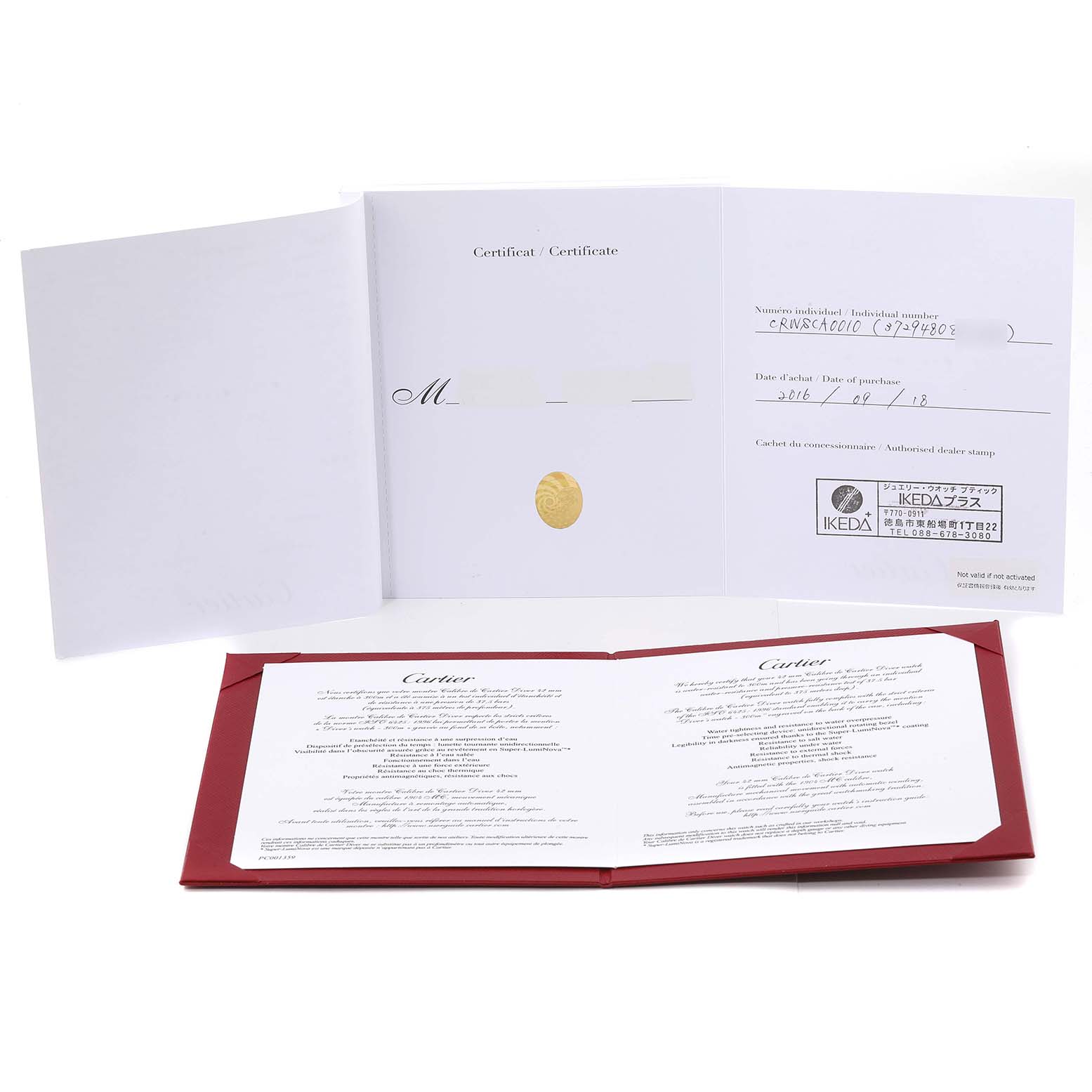 The image shows the warranty and certificate booklets for a Calibre de Cartier model by Cartier, displayed open.
