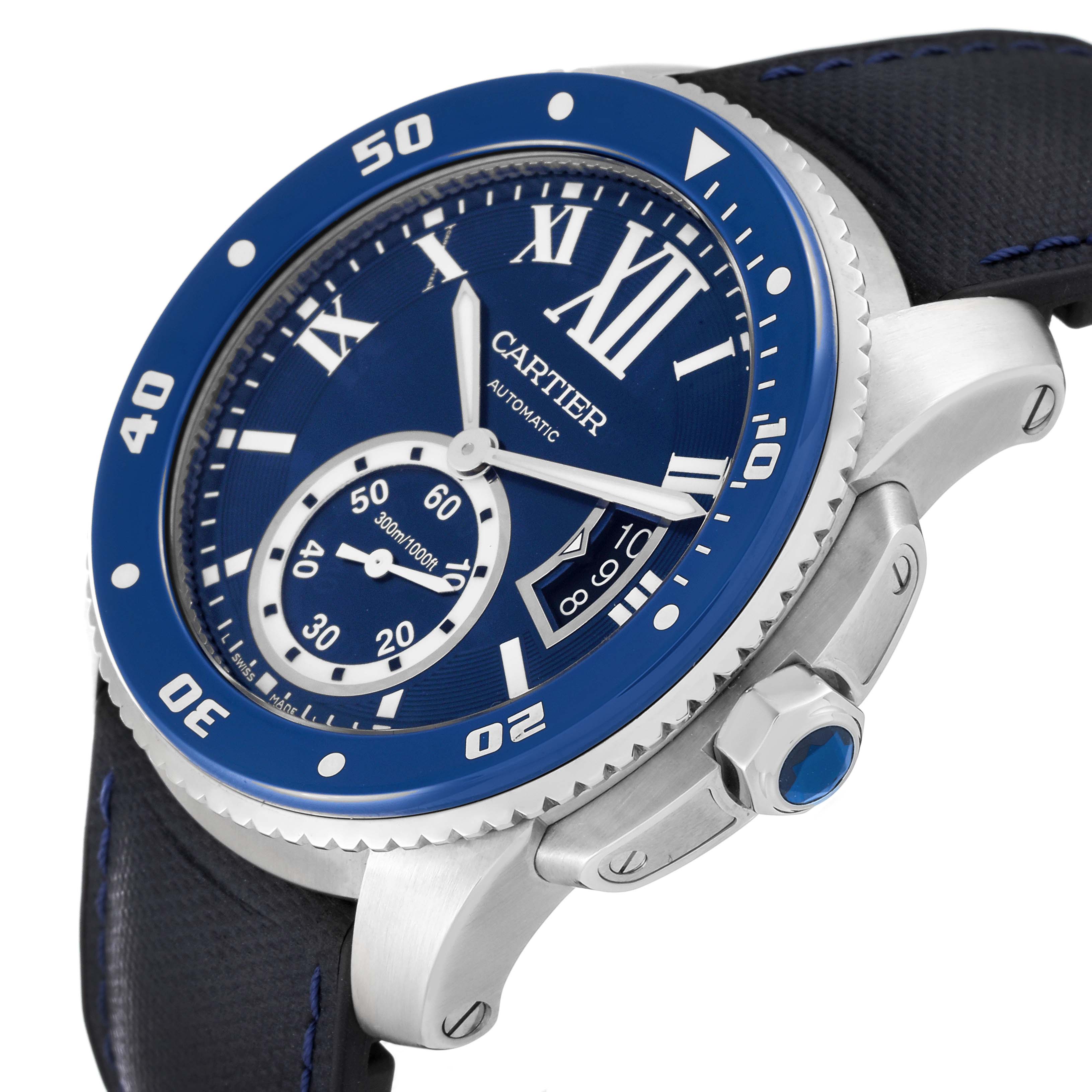The image shows a side angle of the Calibre de Cartier watch by Cartier, highlighting the blue bezel, dial, and crown.