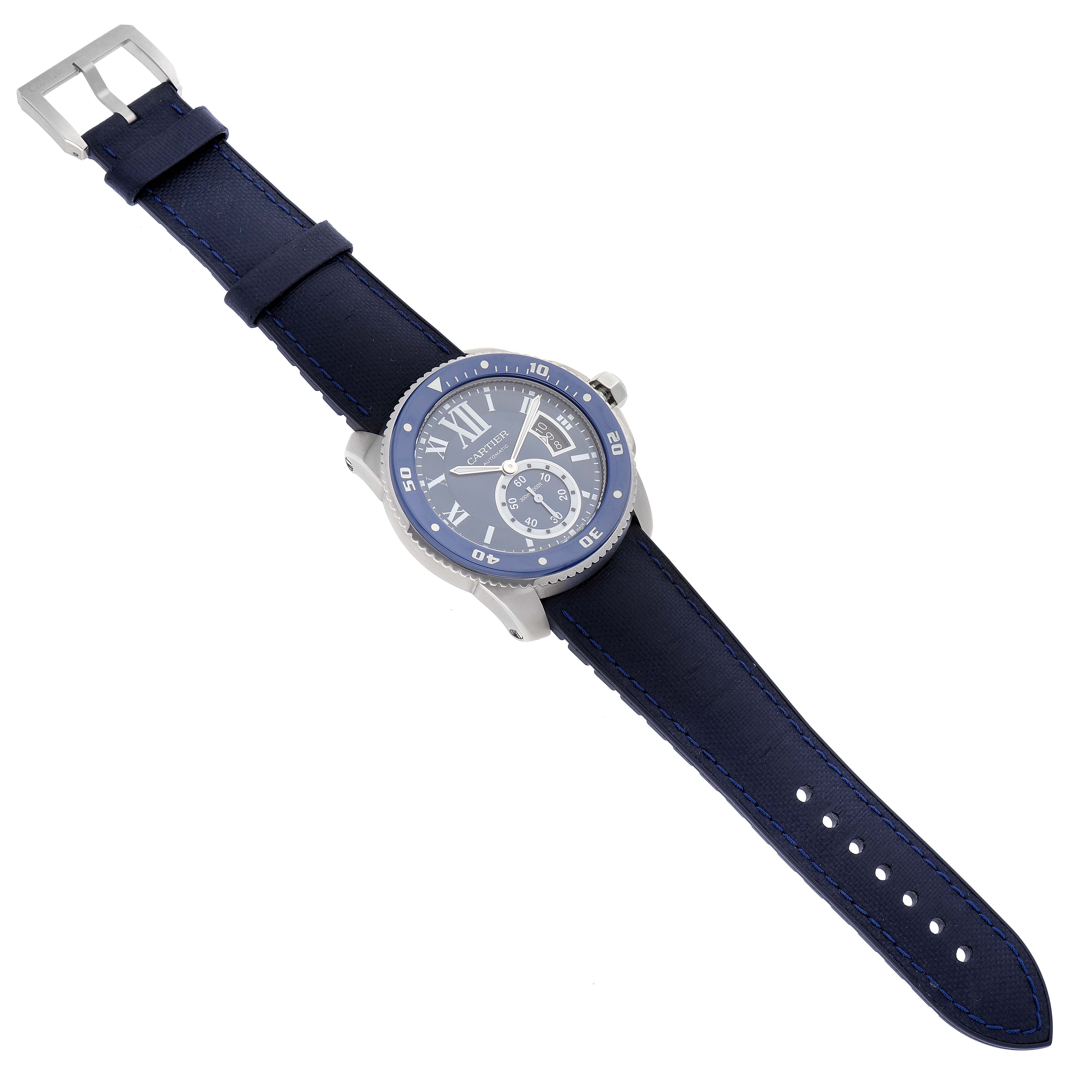 The Calibre de Cartier watch by Cartier is shown at a diagonal angle, displaying its blue dial, bezel, and matching leather strap.