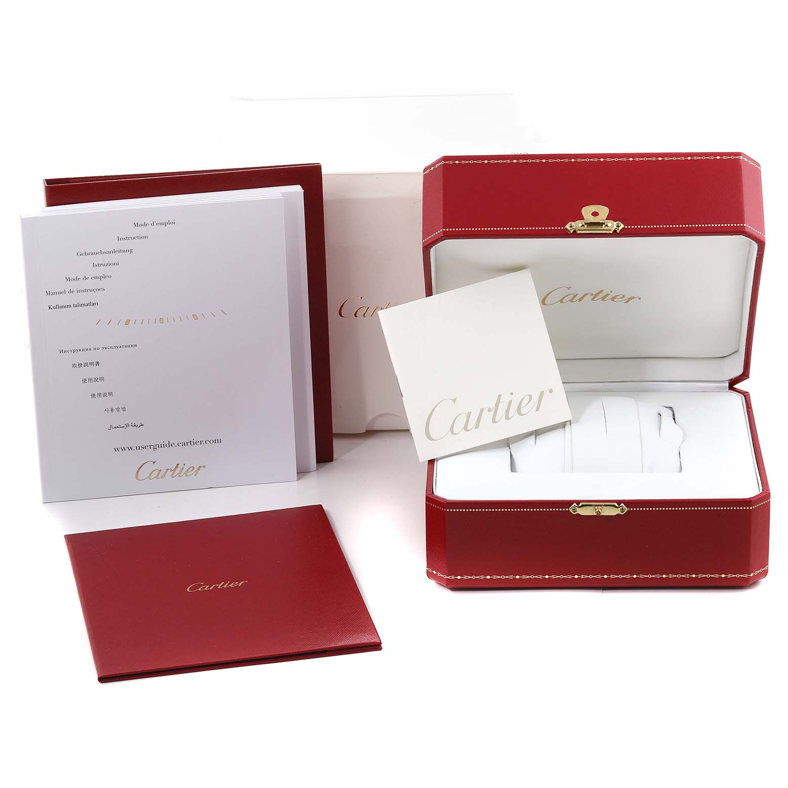 This image shows the packaging and documentation for the Calibre de Cartier watch by Cartier.
