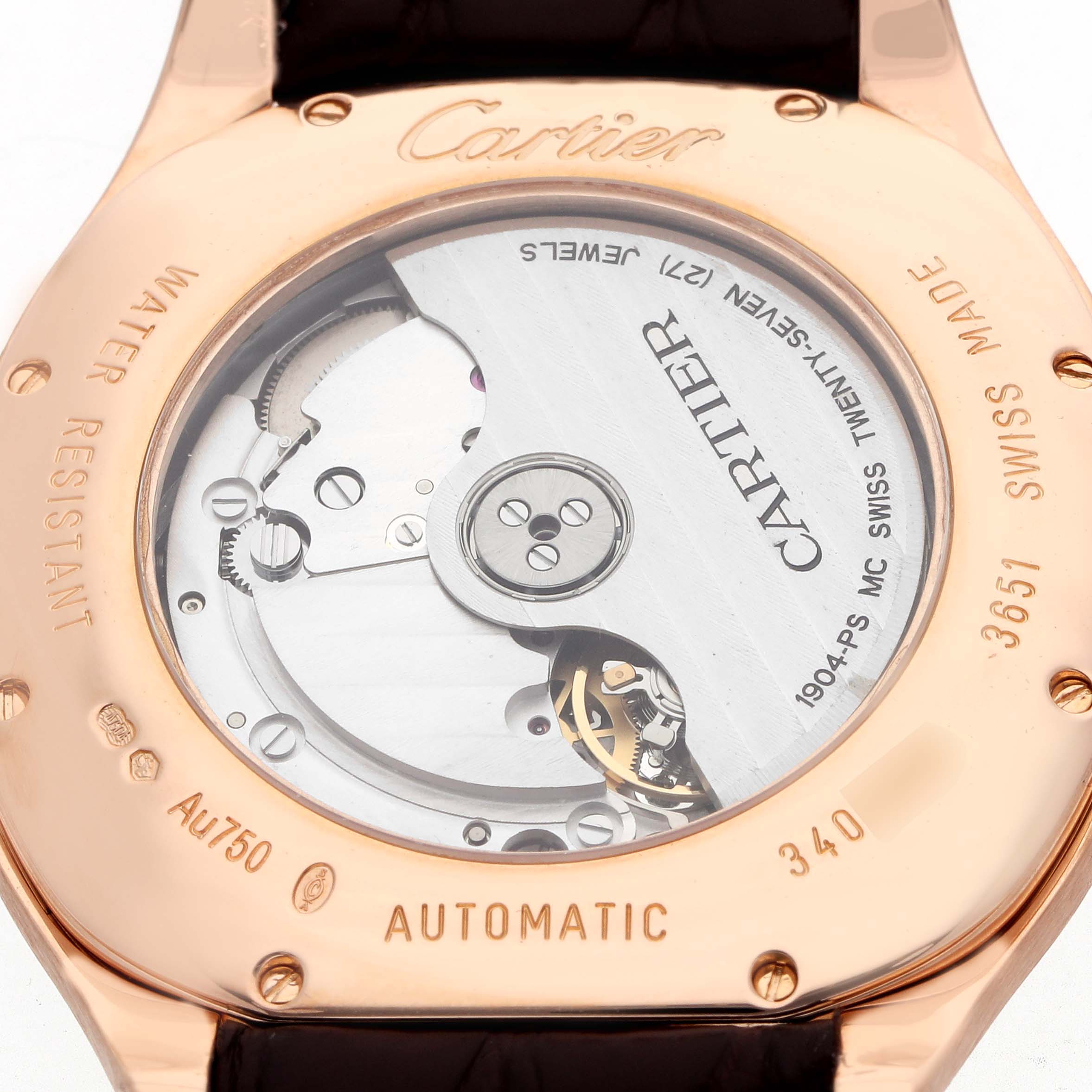 The image shows the back of a Drive de Cartier watch by Cartier, highlighting the automatic movement and inscriptions.