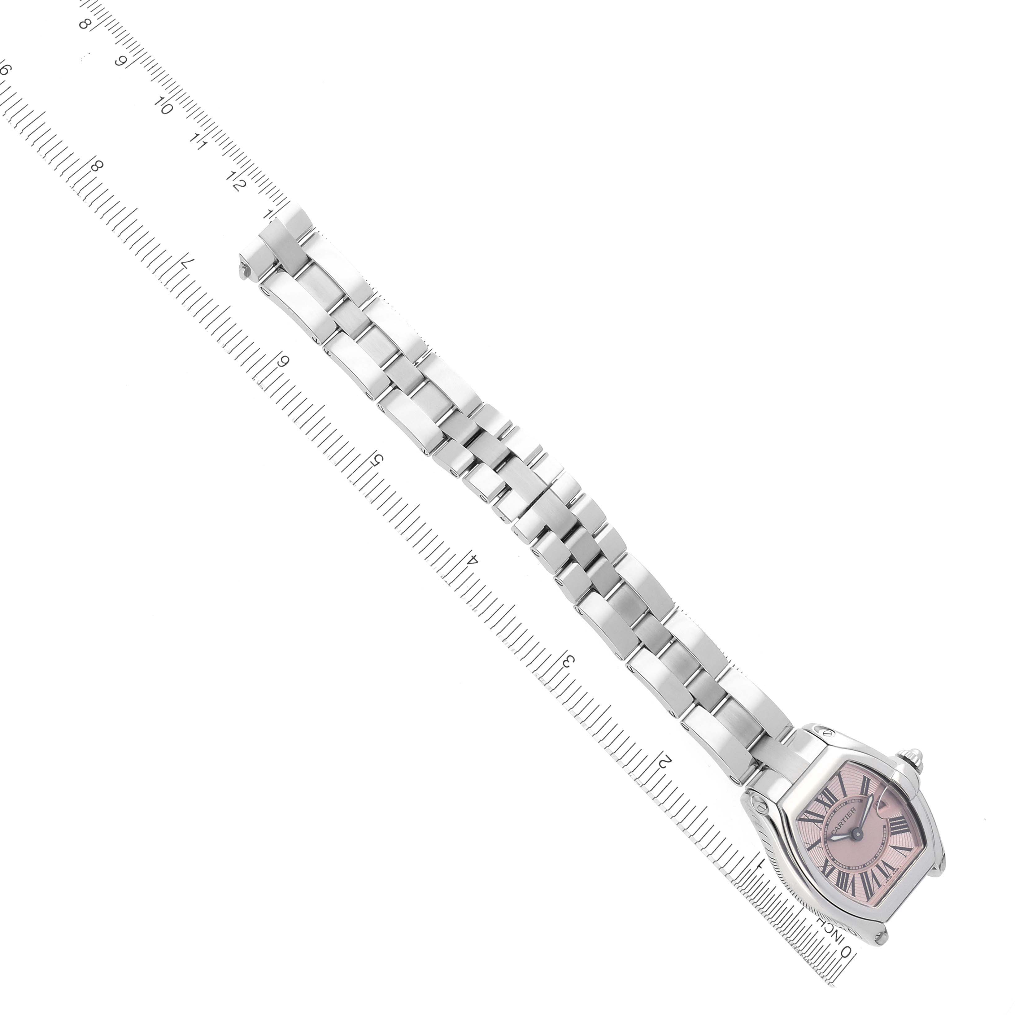 The Cartier Roadster W62017V3 Women's Stainless Steel Pink Dial W62017V3 Women's Stainless Steel Pink Dial watch is shown from an overhead angle, highlighting the face, bracelet, and clasp.