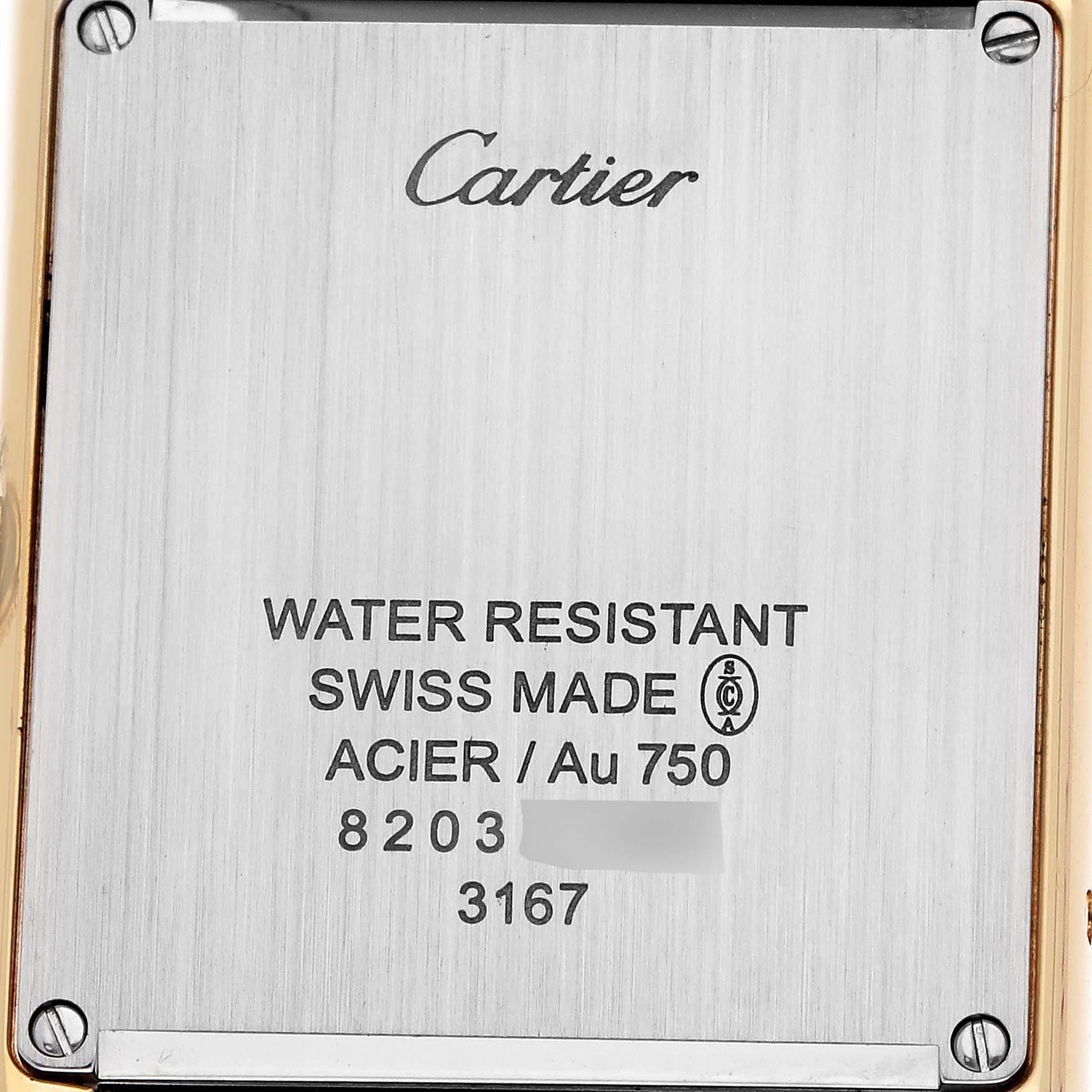 The image shows the back of a Cartier Tank Solo W5200004 Men
s Steel and Gold (two tone) Silver Dial watch, highlighting its inscriptions and screws.