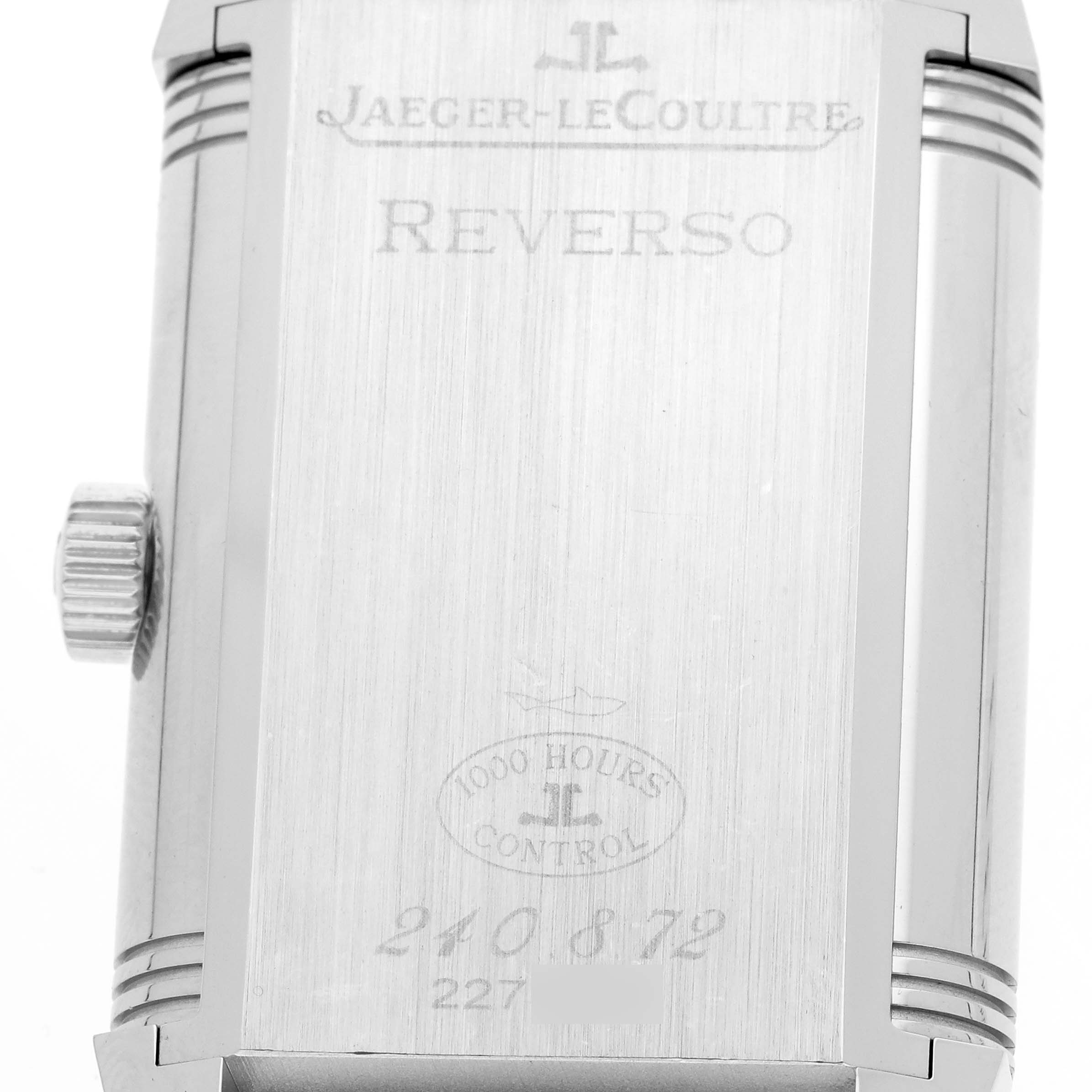 The image shows the back case of a Jaeger-LeCoultre Reverso, highlighting the crown and inscriptions.