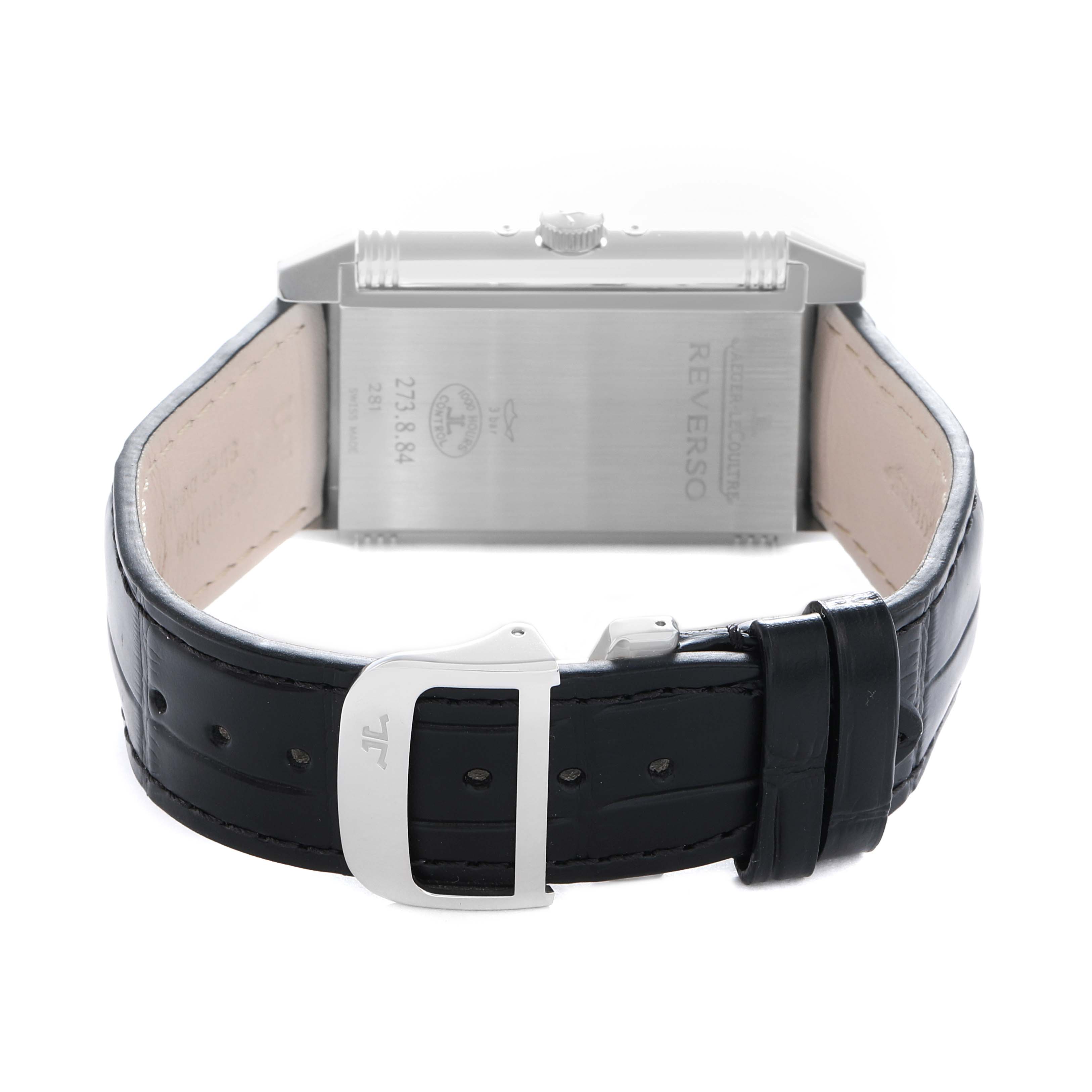 The image shows the back of the Jaeger-LeCoultre Reverso watch, highlighting the strap and buckle.