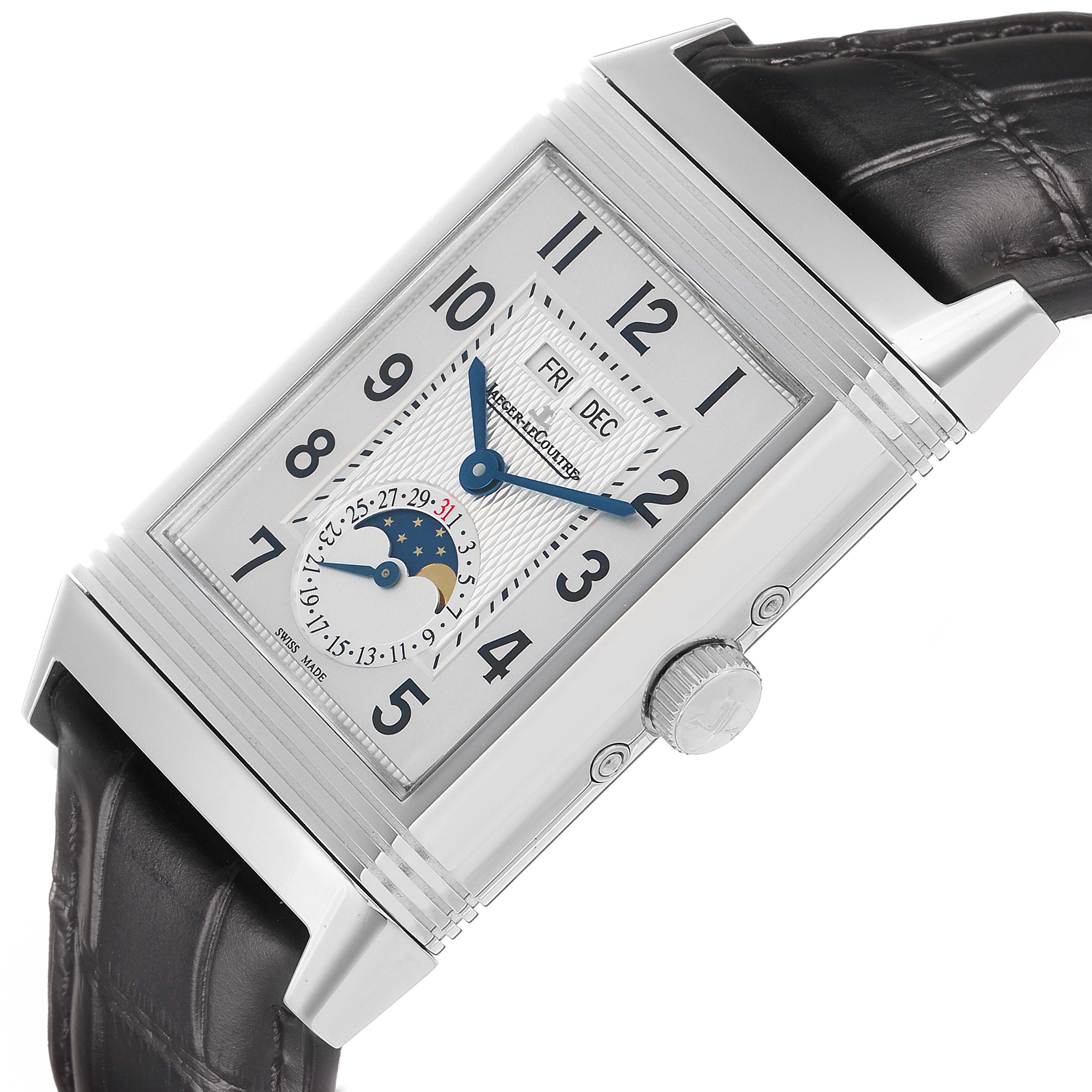 The Jaeger-LeCoultre Reverso watch is shown at an angle, highlighting its face with moon phase, day, and month indicators, along with its side crown and leather strap.