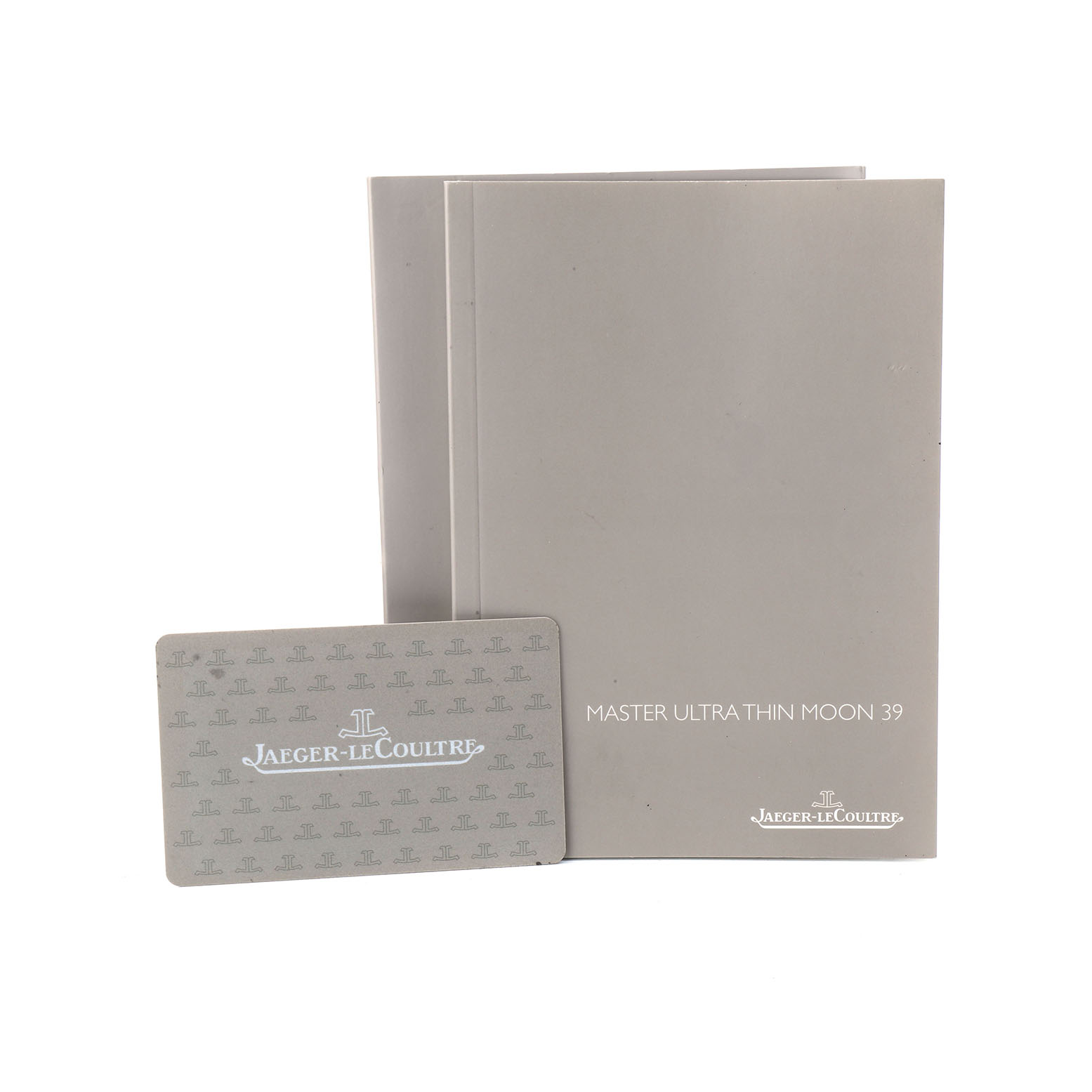 The image shows the manuals and warranty card for the Jaeger-LeCoultre Master Ultra Thin Moon 39 watch.