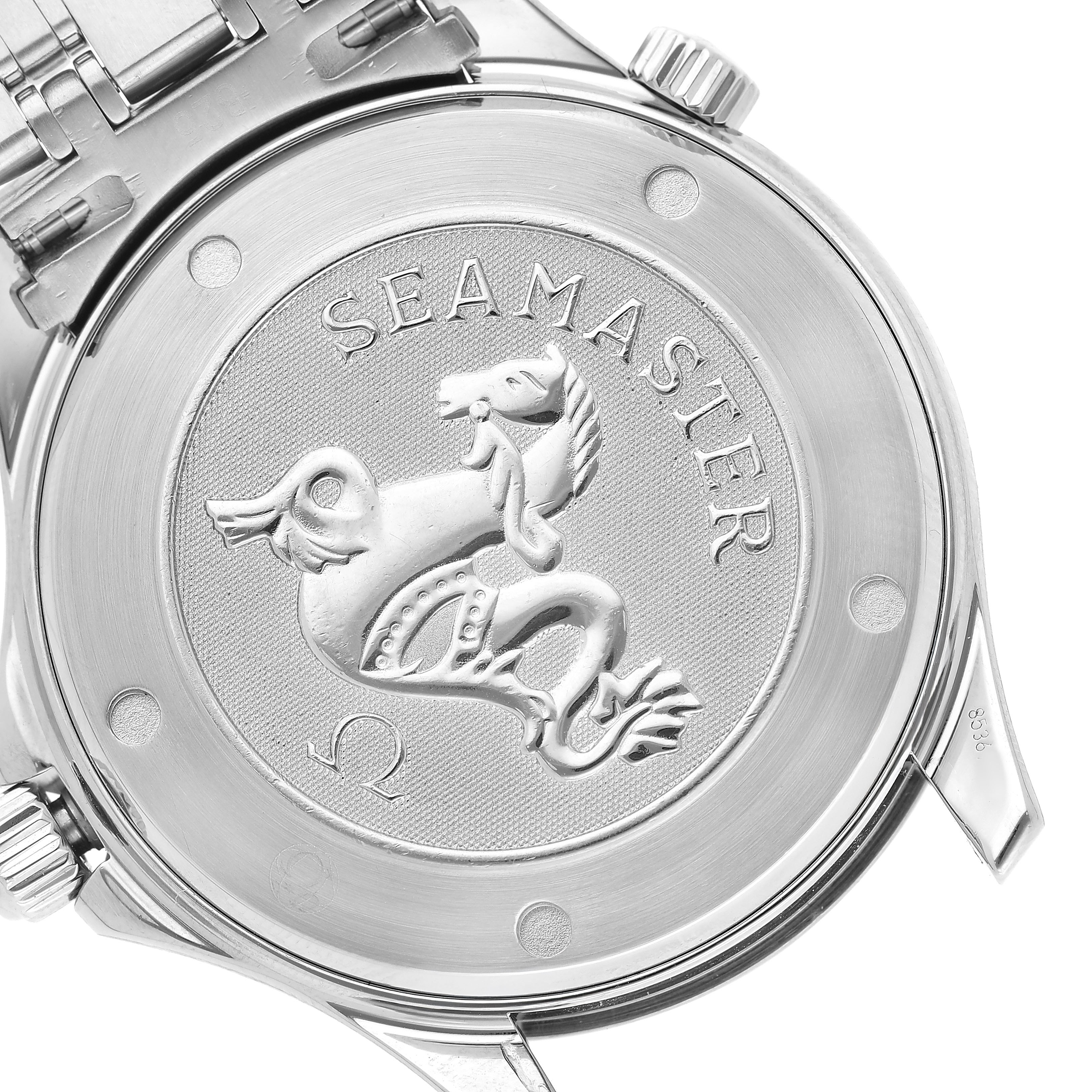 The image shows the back case of an Omega Seamaster 212.30.41.20.01.002 Men's Stainless Steel Black Dial watch with its engraved emblem and part of the bracelet.