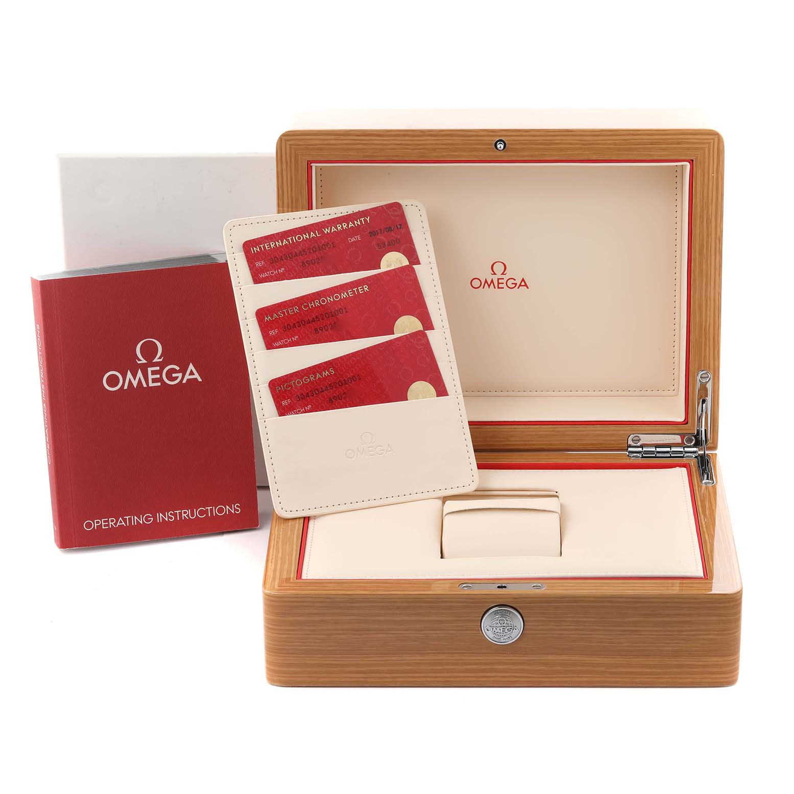 The image shows an Omega Speedmaster 304.30.44.52.01.001 Men
s Stainless Steel Black Dial 304.30.44.52.01.001 Men
s Stainless Steel Black Dial
s open wooden box, warranty cards, and operating instructions from a front angle.