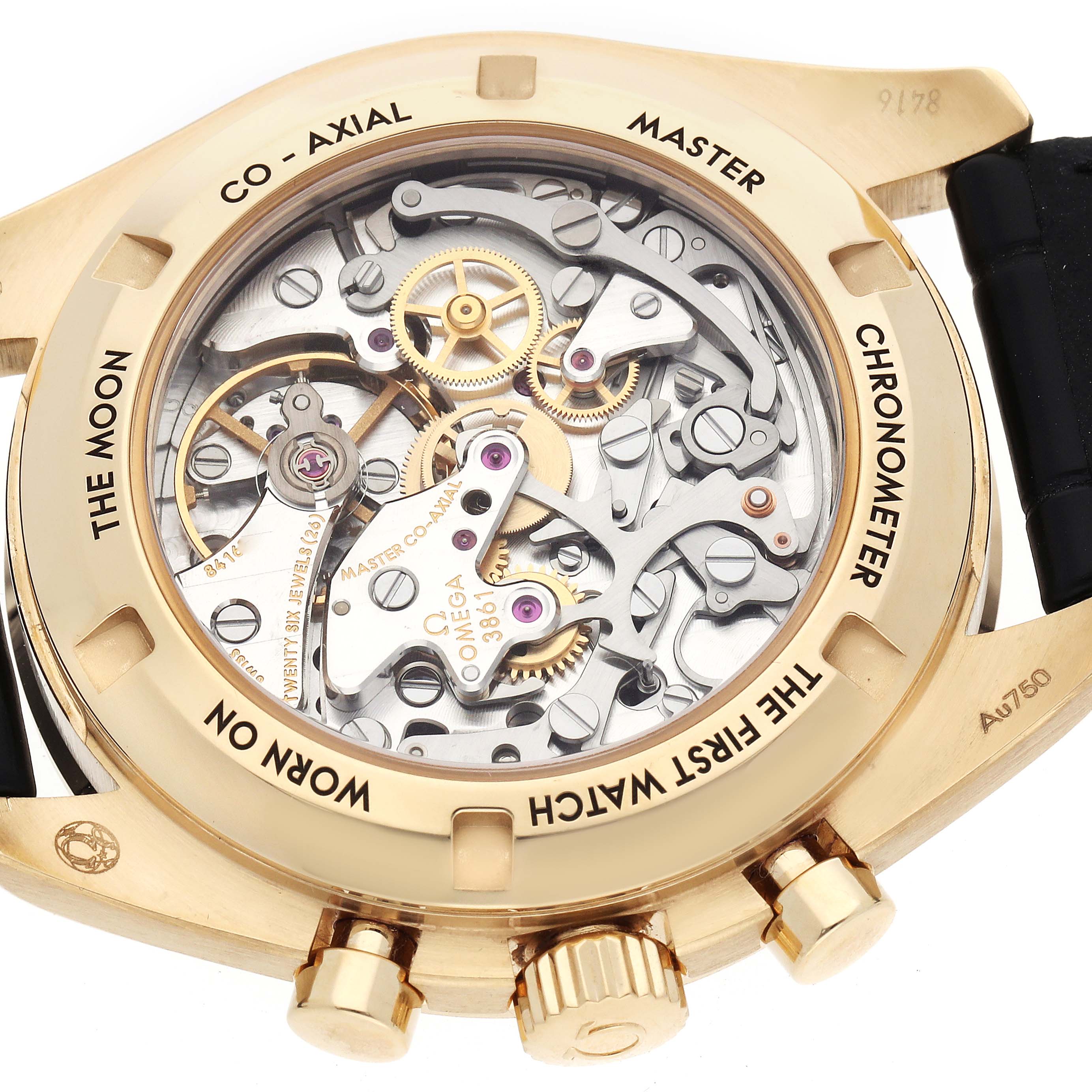 The image shows the back of the Omega Speedmaster 310.62.42.50.99.001 Men
s Yellow Gold Yellow Dial, highlighting the visible movement and engravings on the case back.