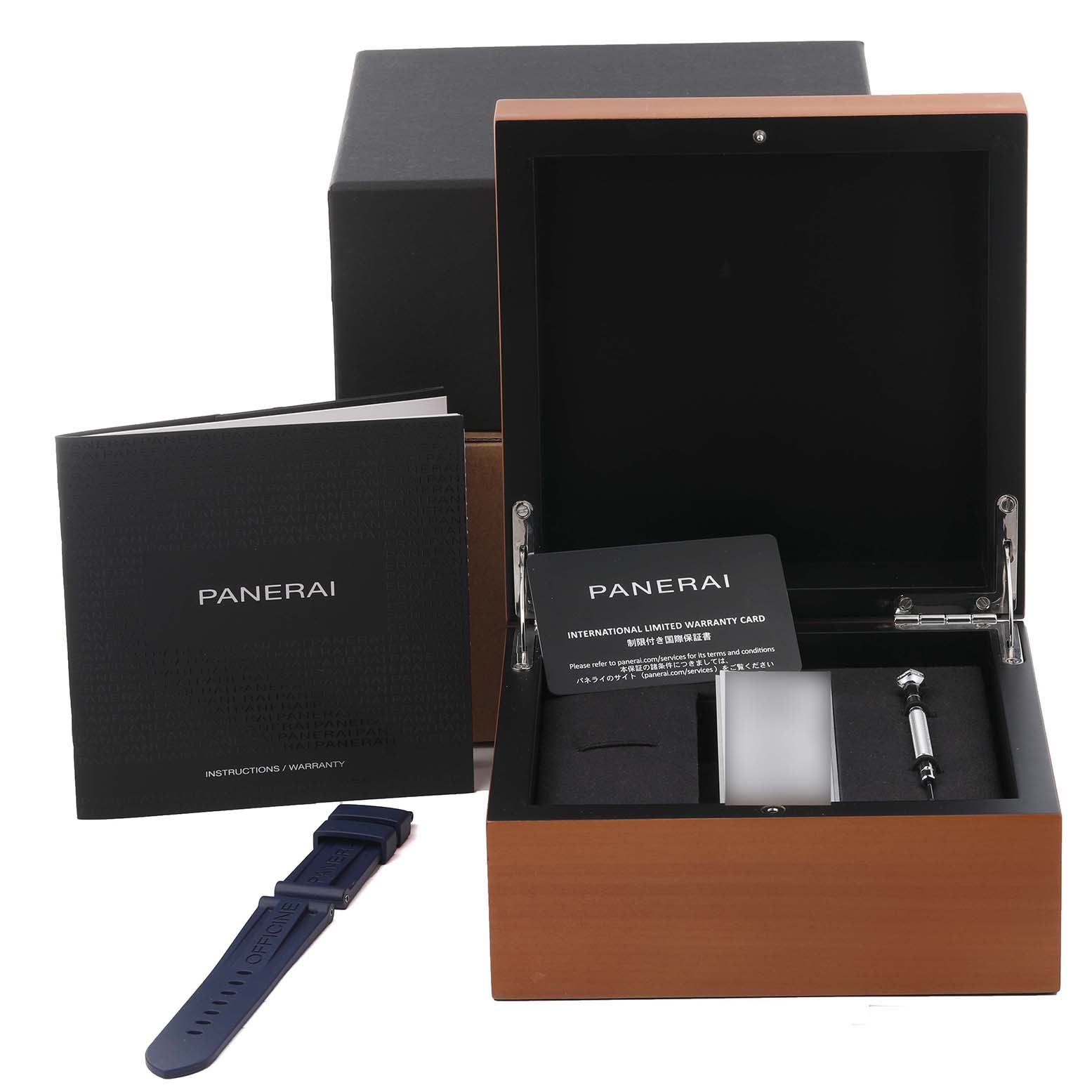 The image shows a Panerai Luminor PAM01135 Men's Ceramic Blue Dial PAM01135 Men's Ceramic Blue Dial watch box, booklet, warranty card, strap, and tool from a front angle.