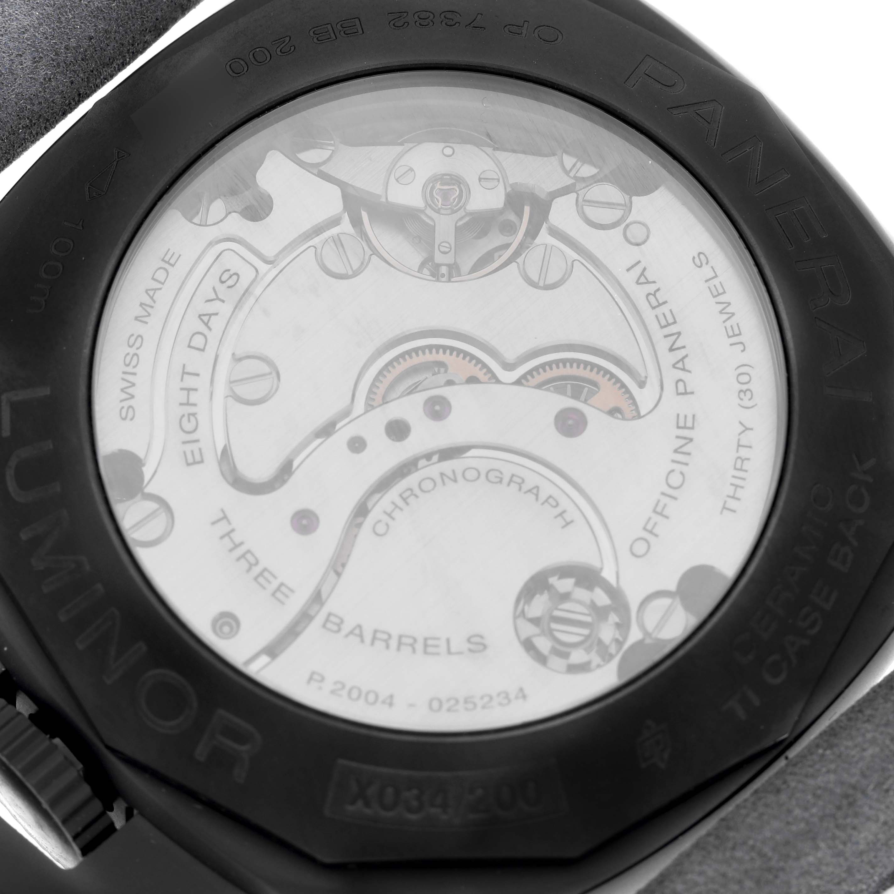 The image shows the back of a Panerai Luminor PAM01135 Men's Ceramic Blue Dial PAM01135 Men's Ceramic Blue Dial watch, highlighting its inner mechanics and engravings.