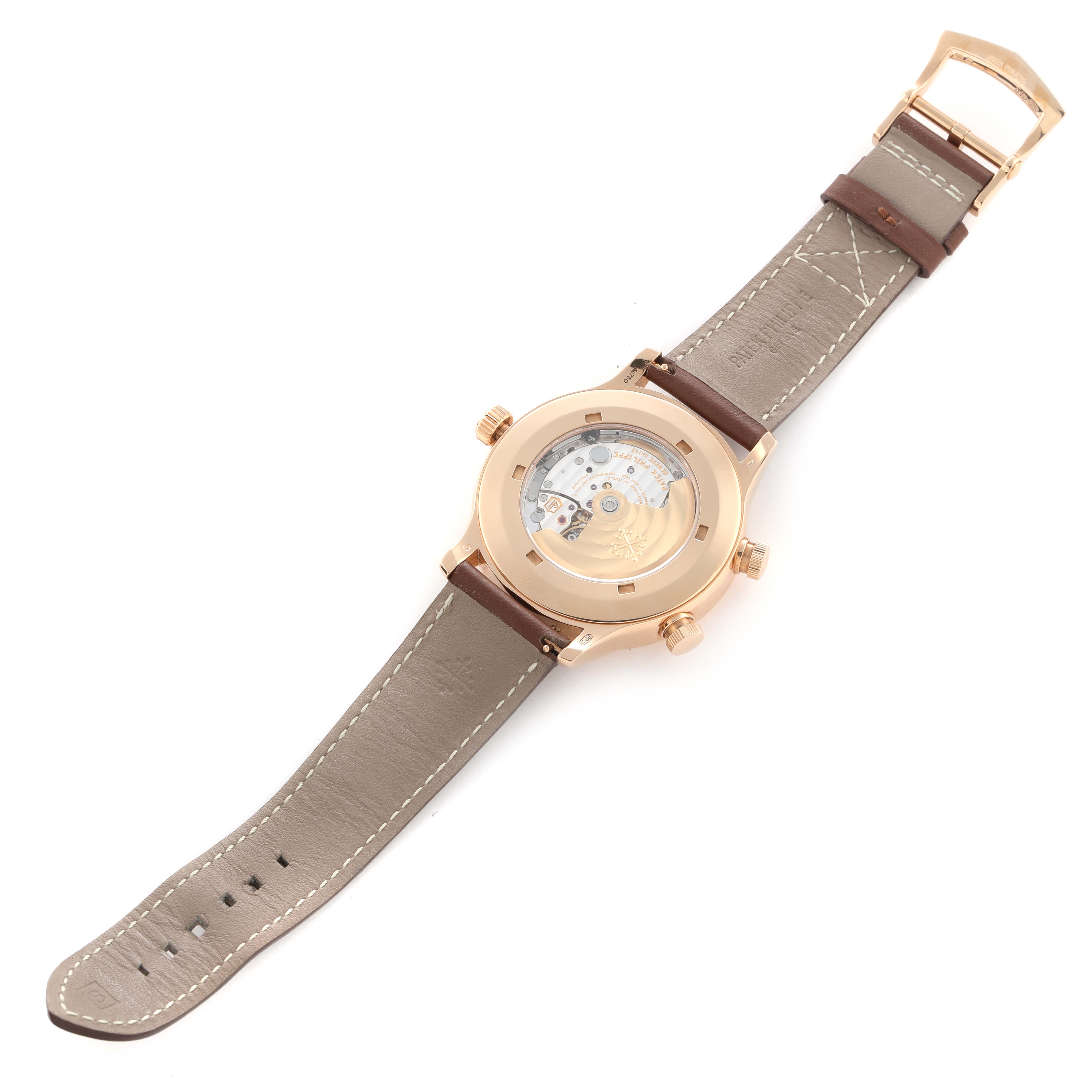 The image shows the back view of the Patek Philippe Calatrava 5524R Men's Rose Gold Brown Dial, highlighting its movement and leather strap.