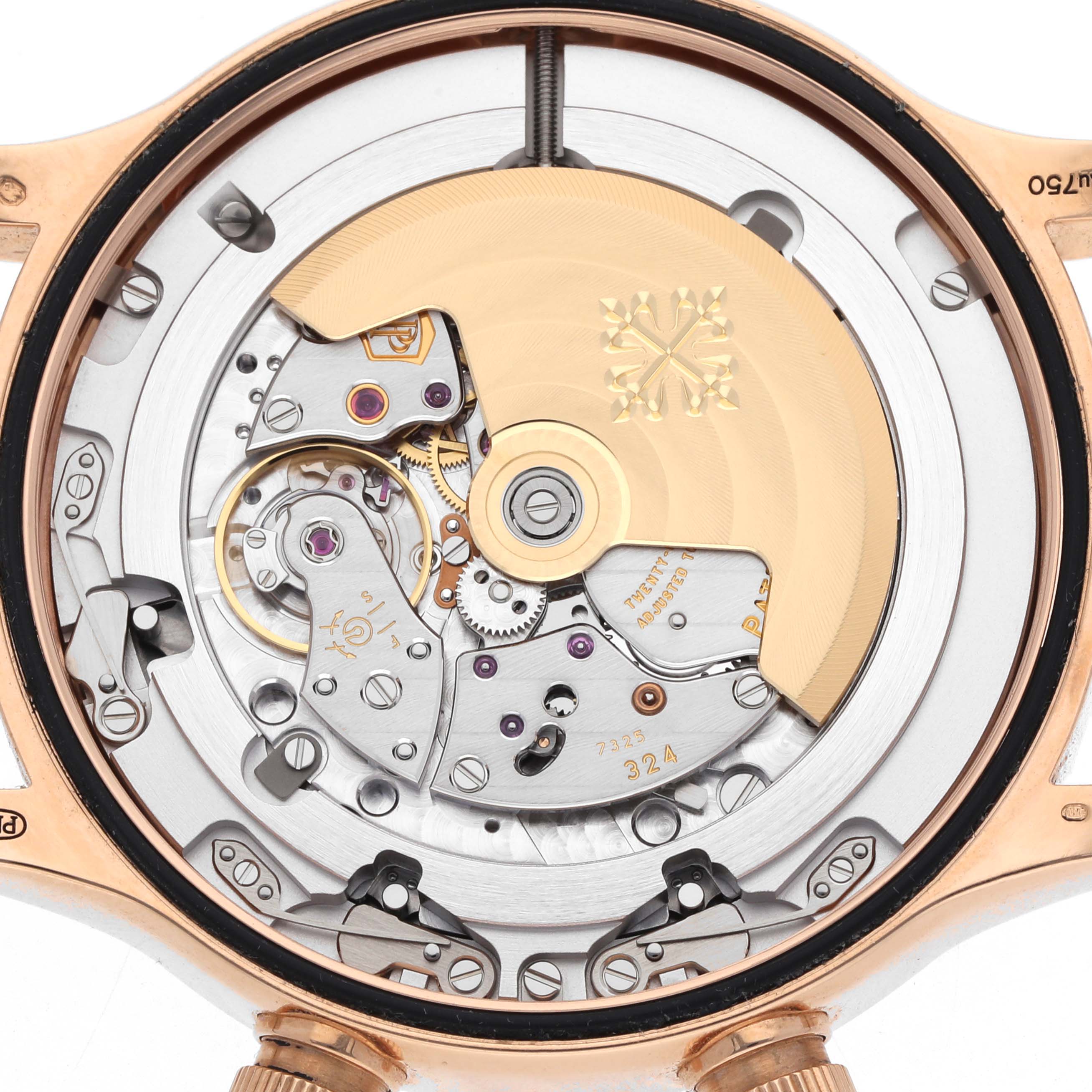 The image shows the back view of a Patek Philippe Calatrava 5524R Men's Rose Gold Brown Dial, highlighting its movement and intricate components.