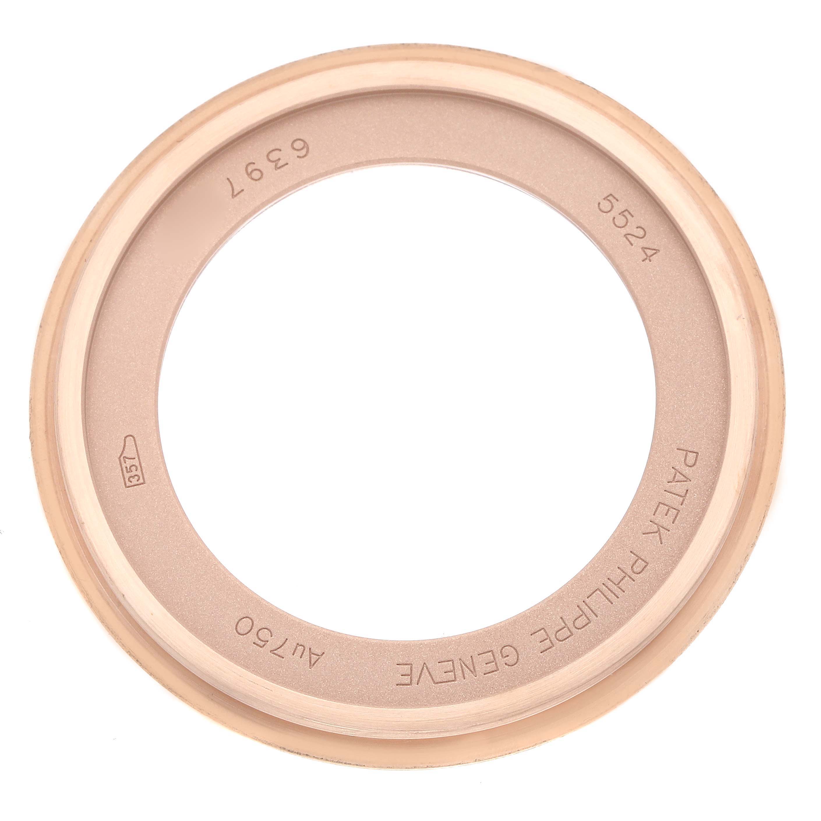 This image shows the case back of a Patek Philippe Calatrava 5524R Men's Rose Gold Brown Dial model viewed from above.
