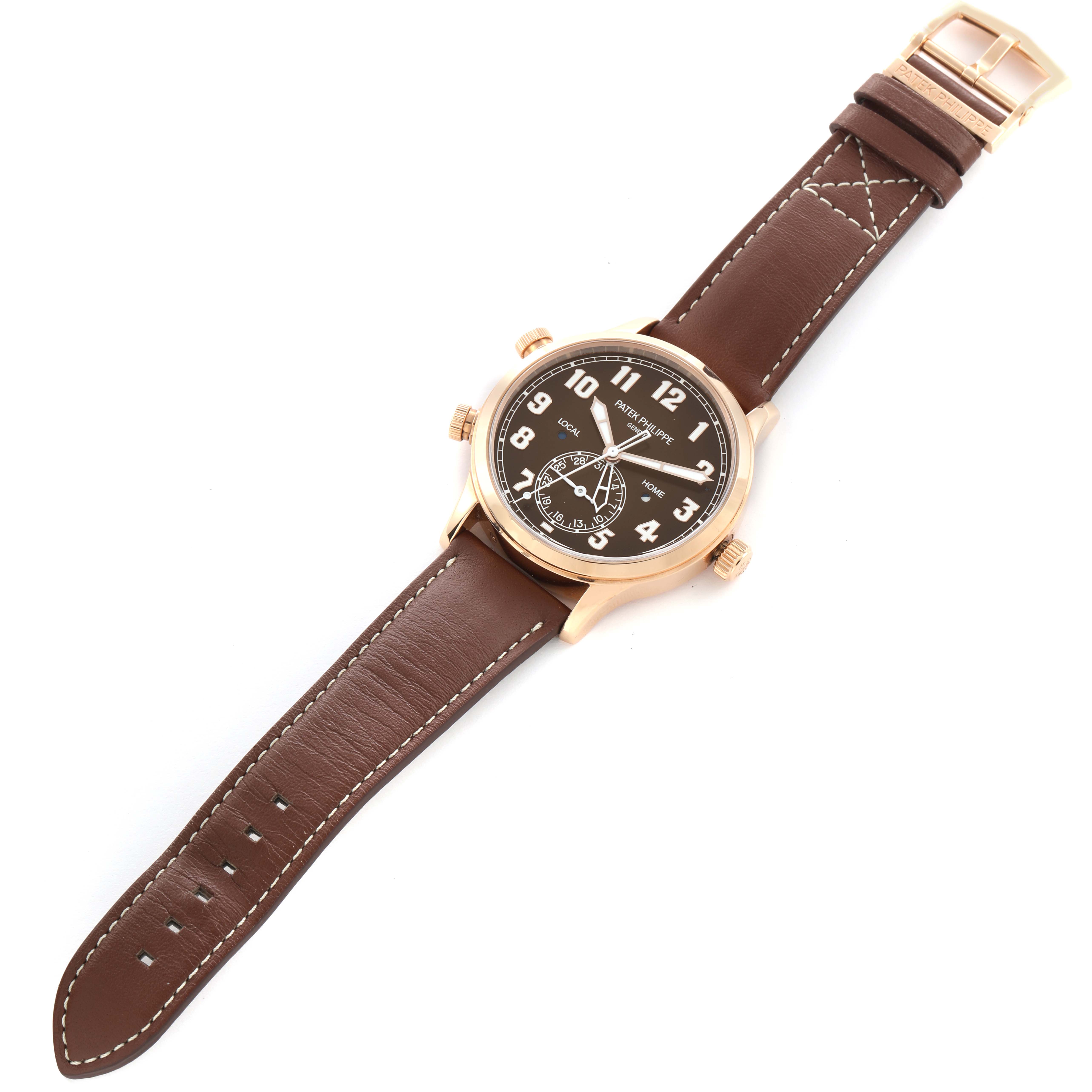 The Patek Philippe Calatrava 5524R Men's Rose Gold Brown Dial model is shown from a top-down angle, displaying the watch face, case, and brown leather strap.