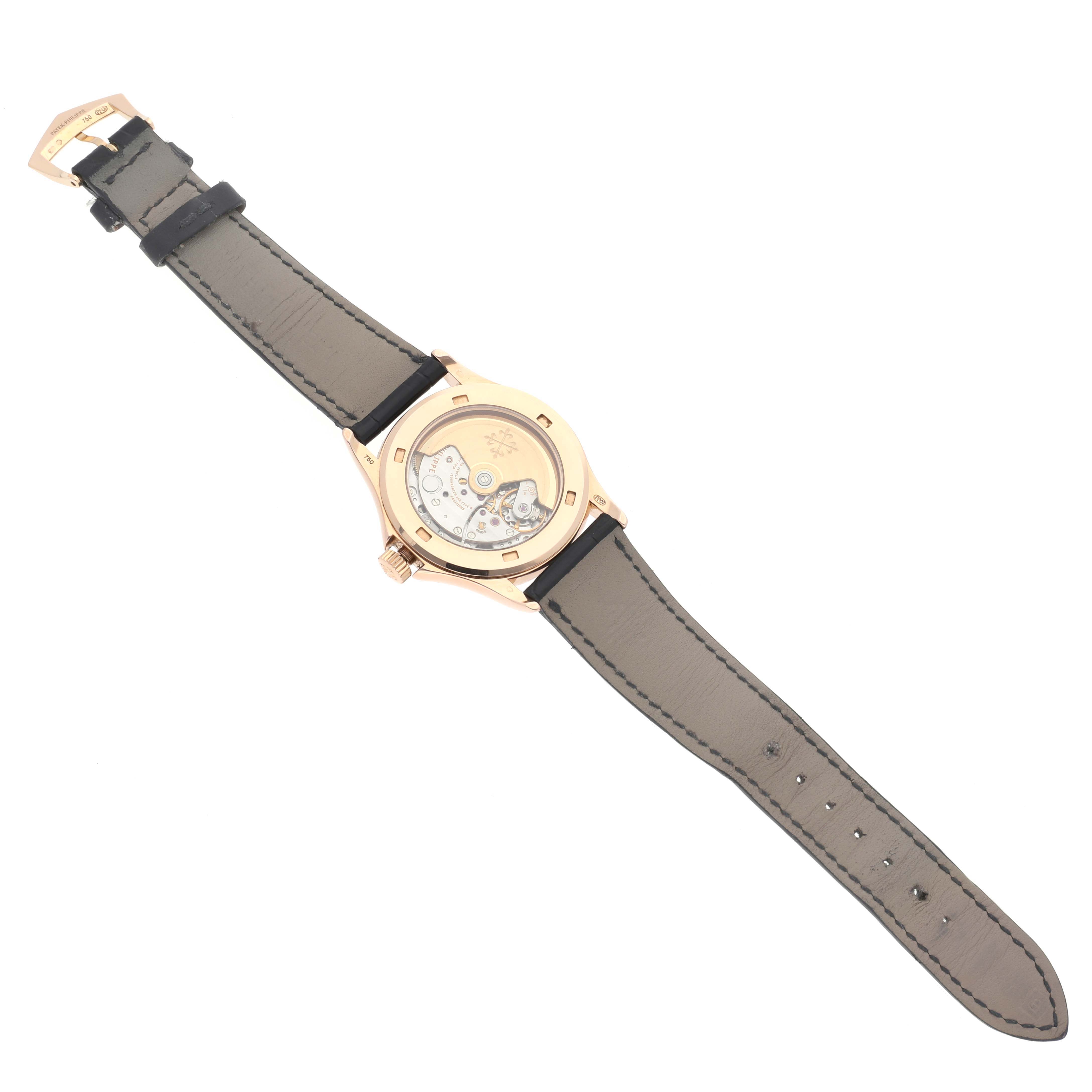 The image shows the back of a Patek Philippe Calatrava 5127R-001 Men's Rose Gold Silver Dial 5127R-001 Men's Rose Gold Silver Dial watch, displaying the mechanical movement and leather strap.