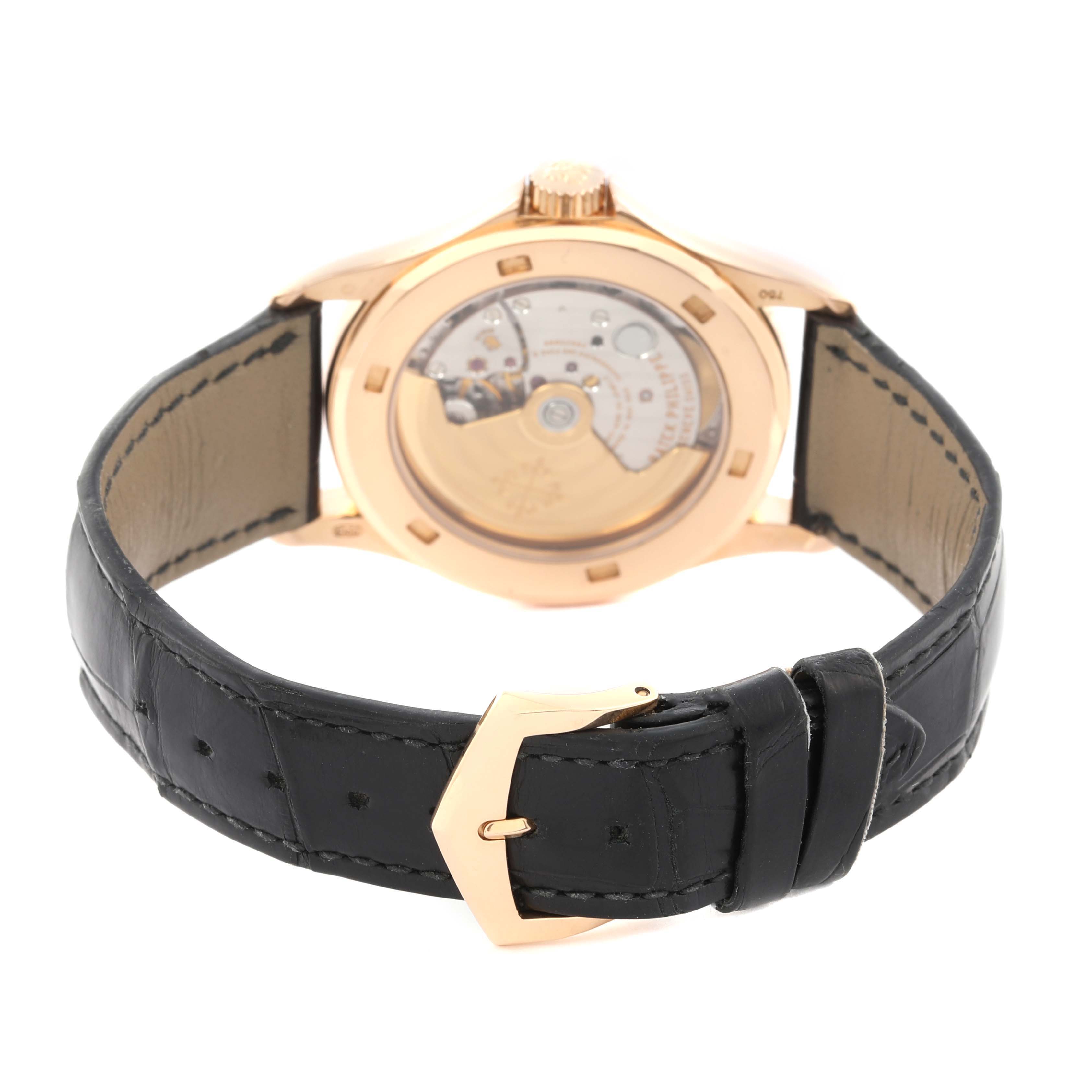 The image shows the back of a Patek Philippe Calatrava 5127R-001 Men's Rose Gold Silver Dial 5127R-001 Men's Rose Gold Silver Dial watch, highlighting the movement and black leather strap.