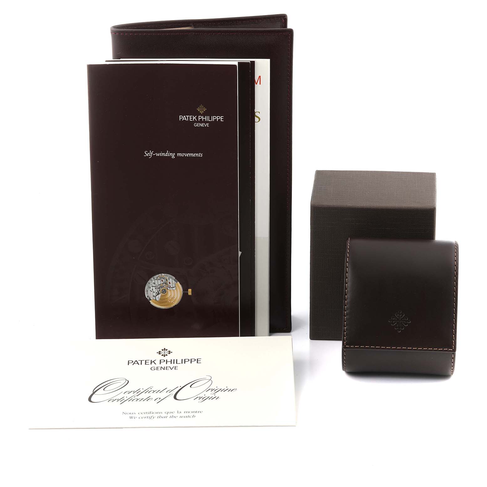 The image shows the Patek Philippe Calatrava 5127R-001 Men's Rose Gold Silver Dial 5127R-001 Men's Rose Gold Silver Dial box, certificate, and booklet from a front angle.