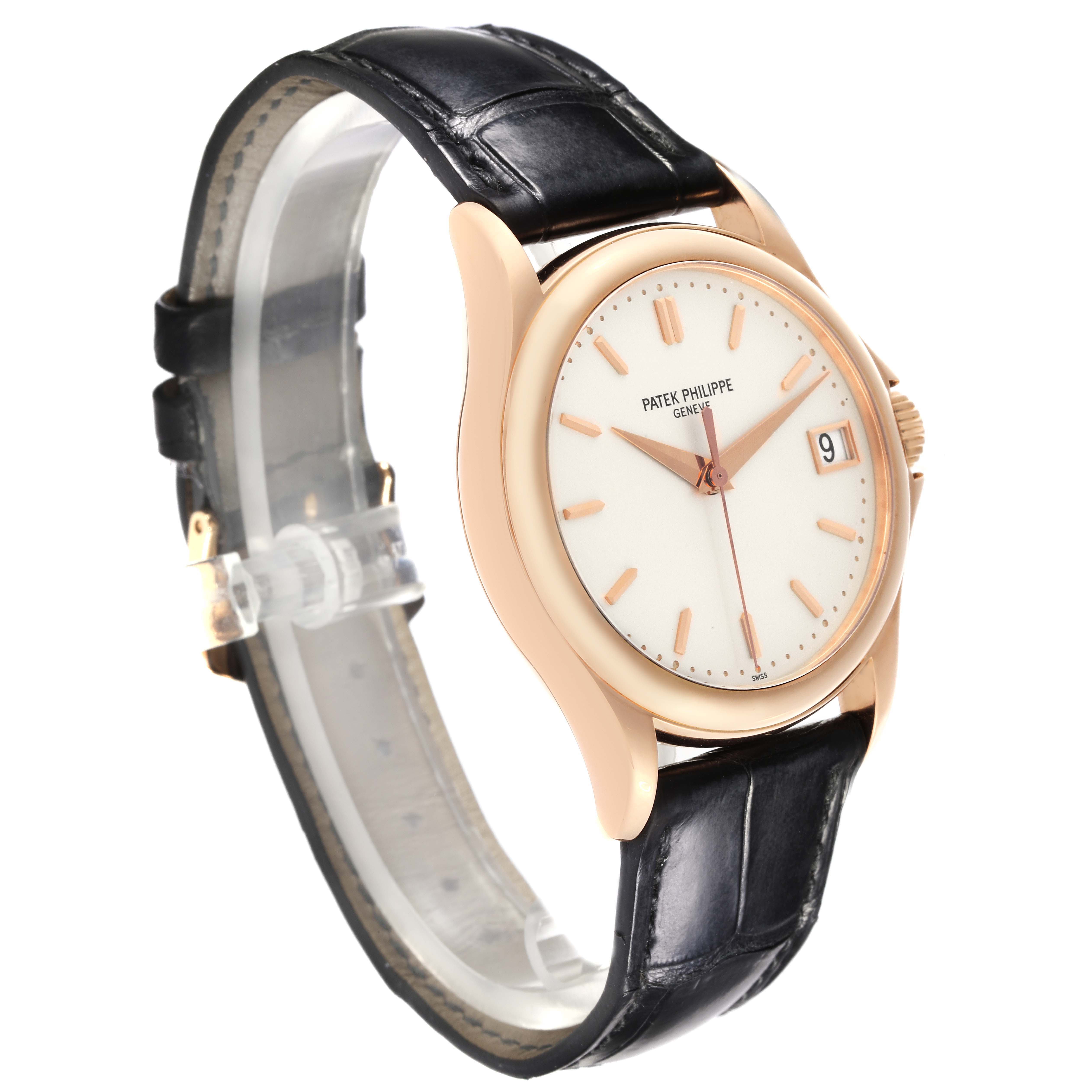 The image shows a Patek Philippe Calatrava 5127R-001 Men's Rose Gold Silver Dial 5127R-001 Men's Rose Gold Silver Dial watch from a side angle, displaying the dial, crown, and leather strap.