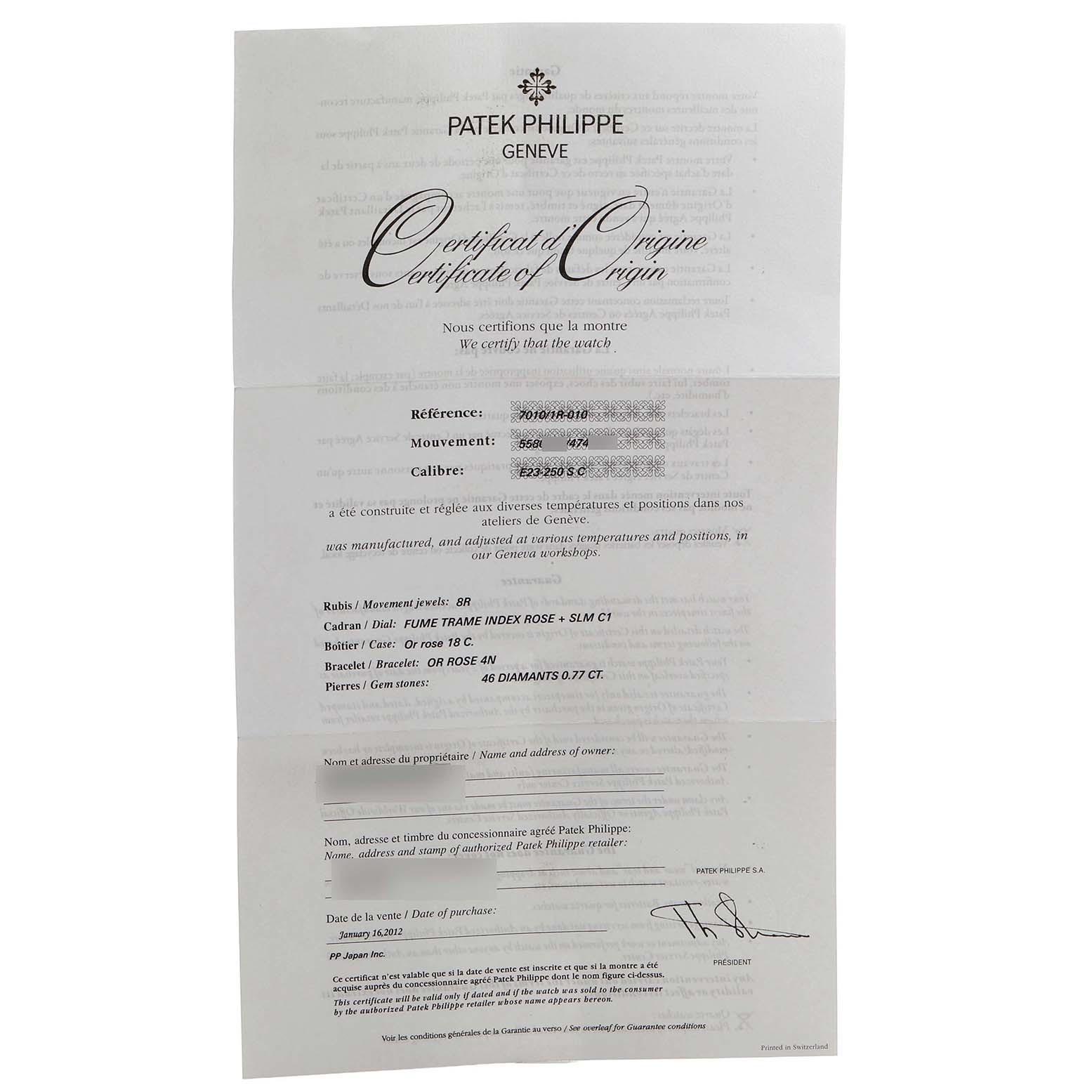 The image shows a Patek Philippe certificate of origin for a Nautilus model, laying flat with text details.