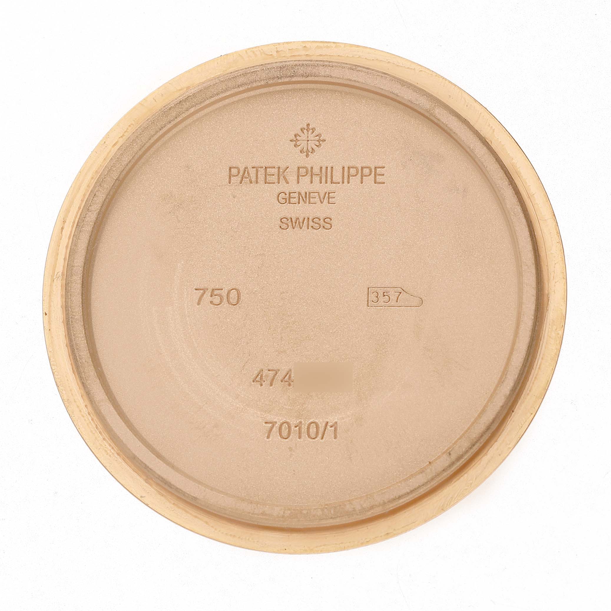 The image shows the inside case back of a Patek Philippe Nautilus 7010/1R-010 Women's Rose Gold Grey Dial watch, displaying brand markings and serial information.