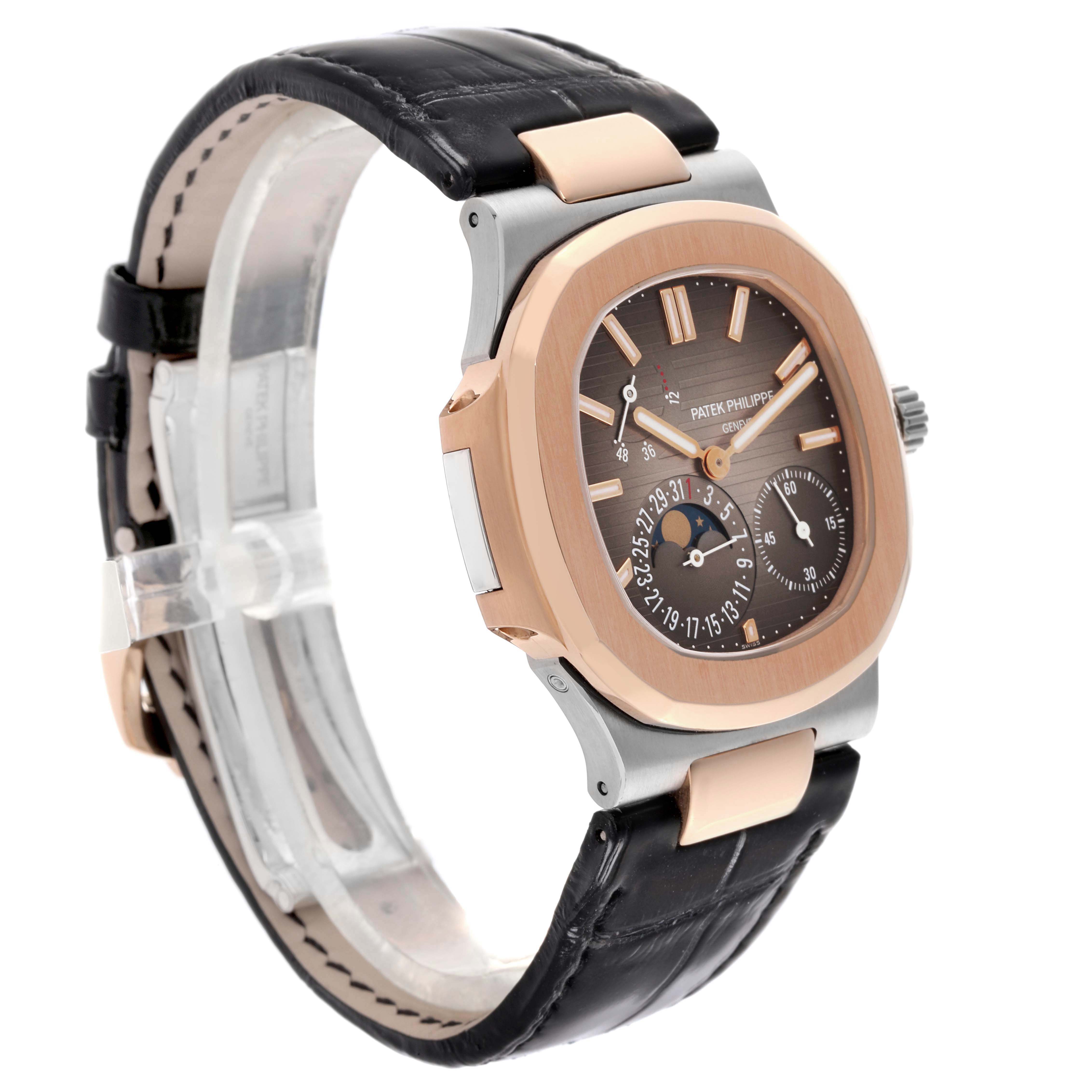 The Patek Philippe Nautilus 5712GR-001 Men's White Gold Grey Dial 5712GR-001 Men's White Gold Grey Dial watch is shown at an angle highlighting its face, bezel, and black leather strap.