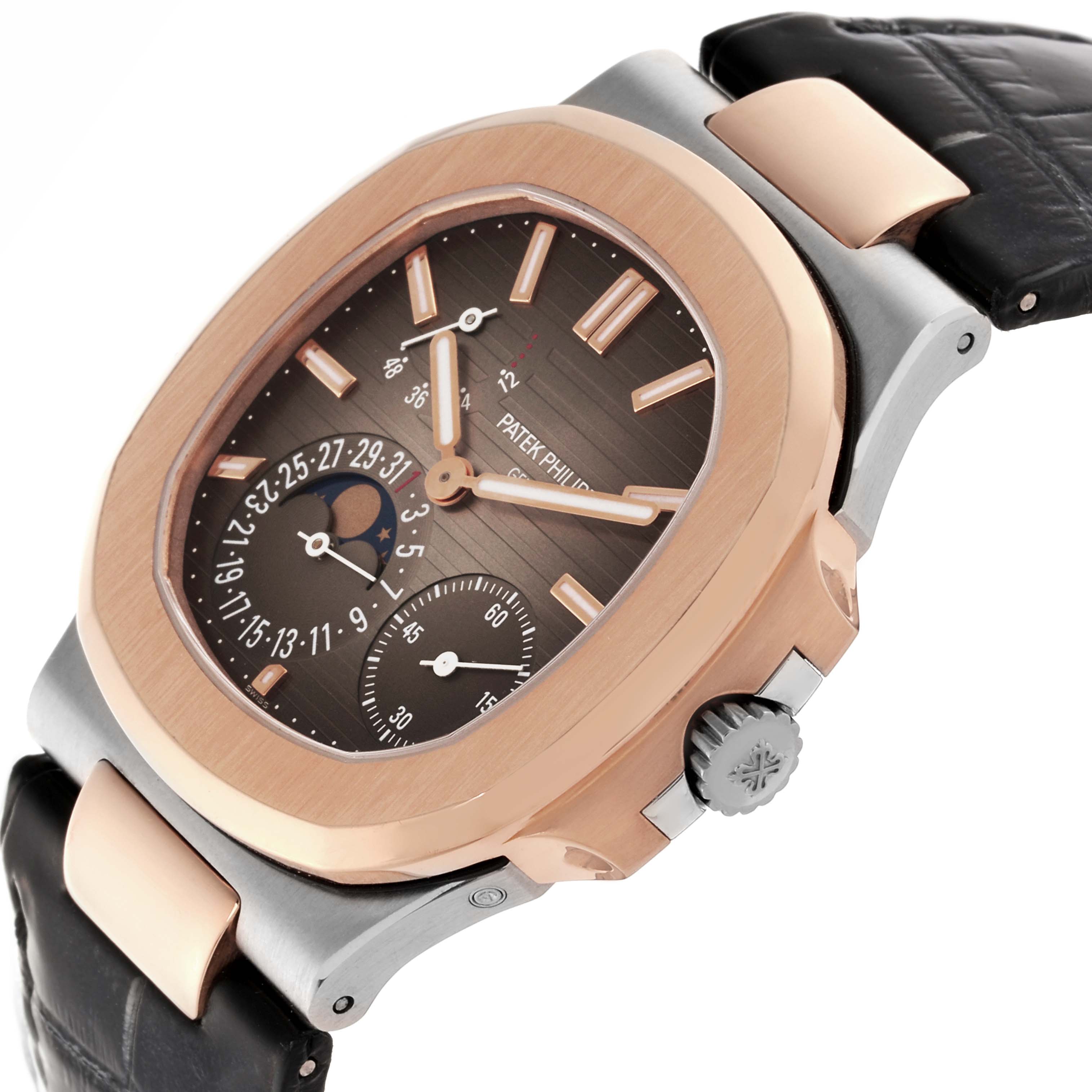 The Patek Philippe Nautilus 5712GR-001 Men's White Gold Grey Dial 5712GR-001 Men's White Gold Grey Dial watch is shown at a three-quarter angle, highlighting the dial, bezel, crown, and leather strap.