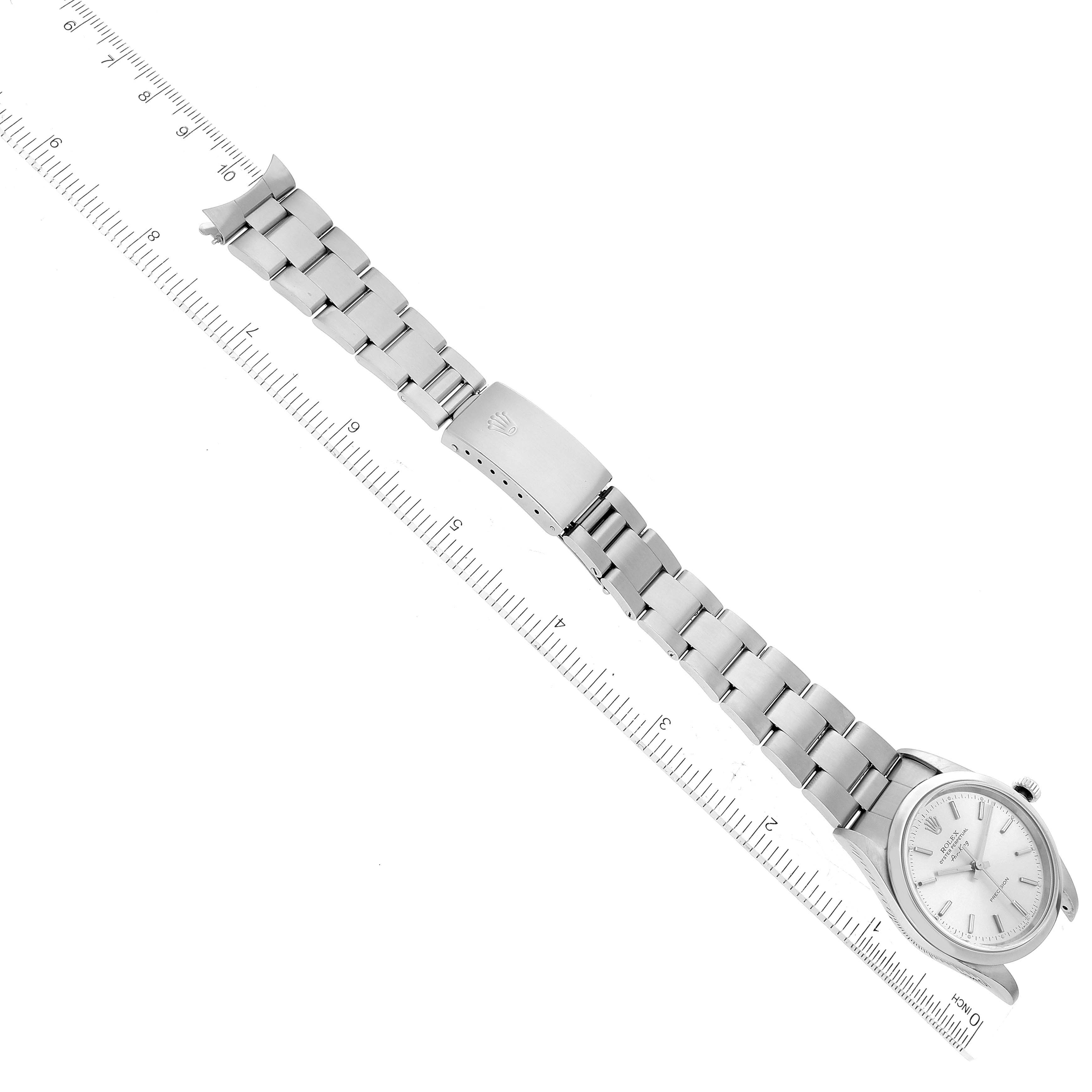 The image shows a Rolex Air-King 14000 Men's Stainless Steel Silver Dial 14000 Men's Stainless Steel Silver Dial watch laid flat with its bracelet fully extended next to a ruler for measurement.