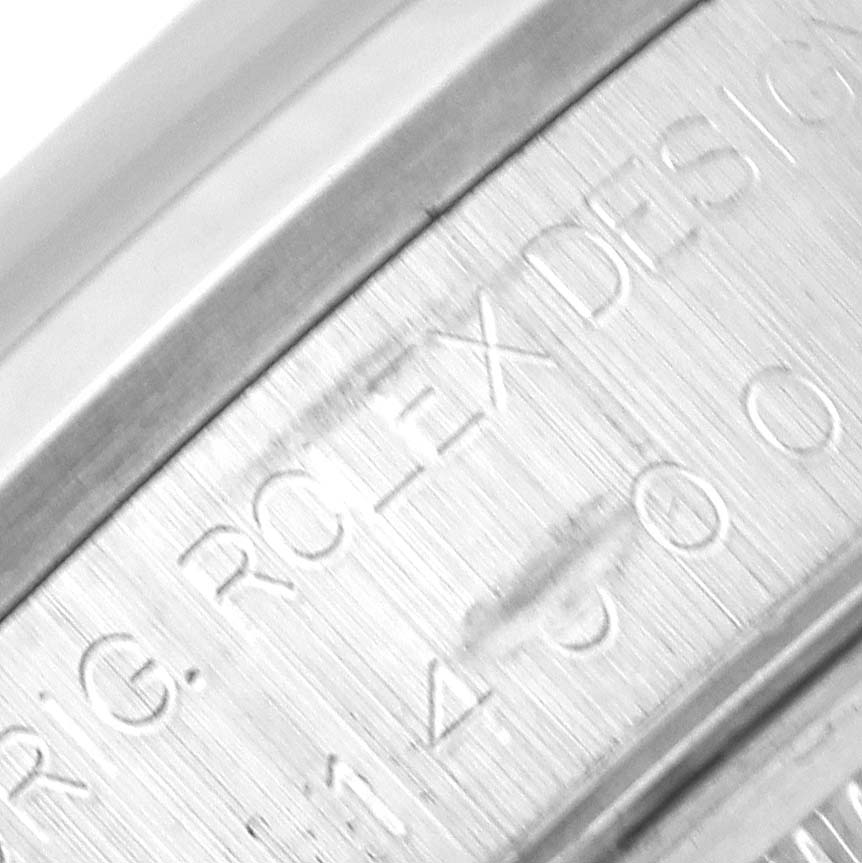 The image shows a close-up of the inside watch case with "Rolex" engraving of the Air-King model.