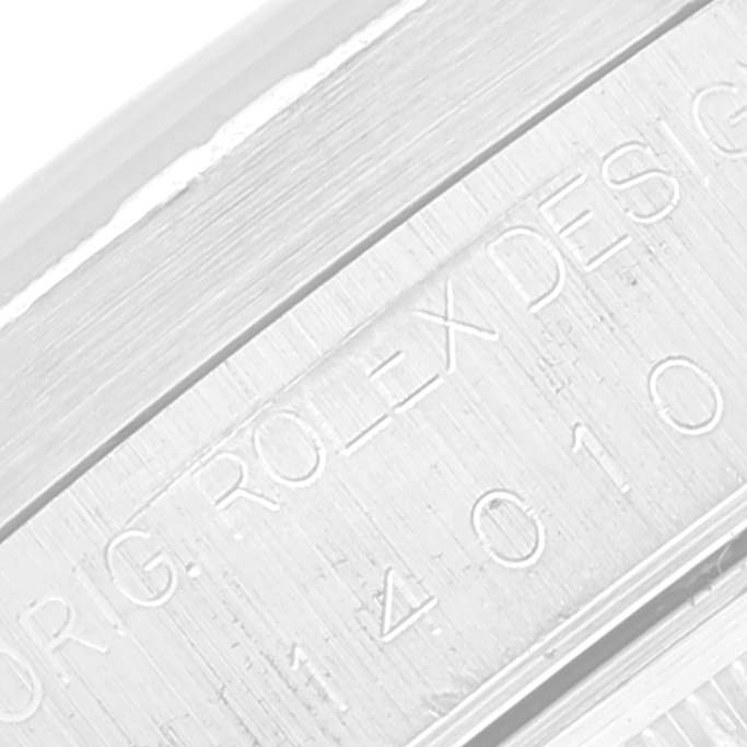 This close-up image shows the engraved model number on the side of the bezel of the Rolex Air-King 14010 Men's Stainless Steel Black Dial 14010 Men's Stainless Steel Black Dial watch.