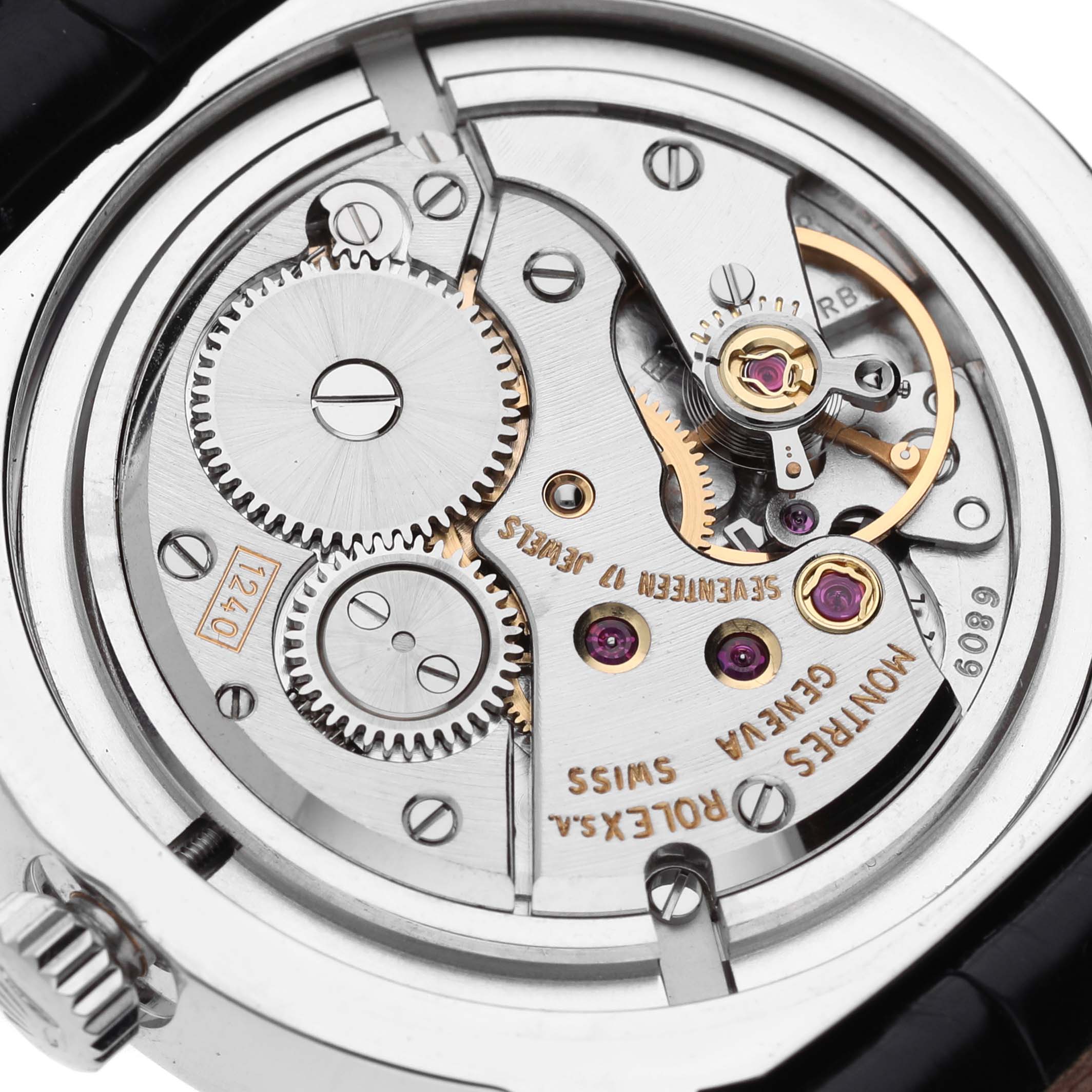 The image shows the movement and gears inside a Rolex Cellini 5240 Men's Platinum Mother of Pearl Dial 5240 Men's Platinum Mother of Pearl Dial watch from a rear angle.