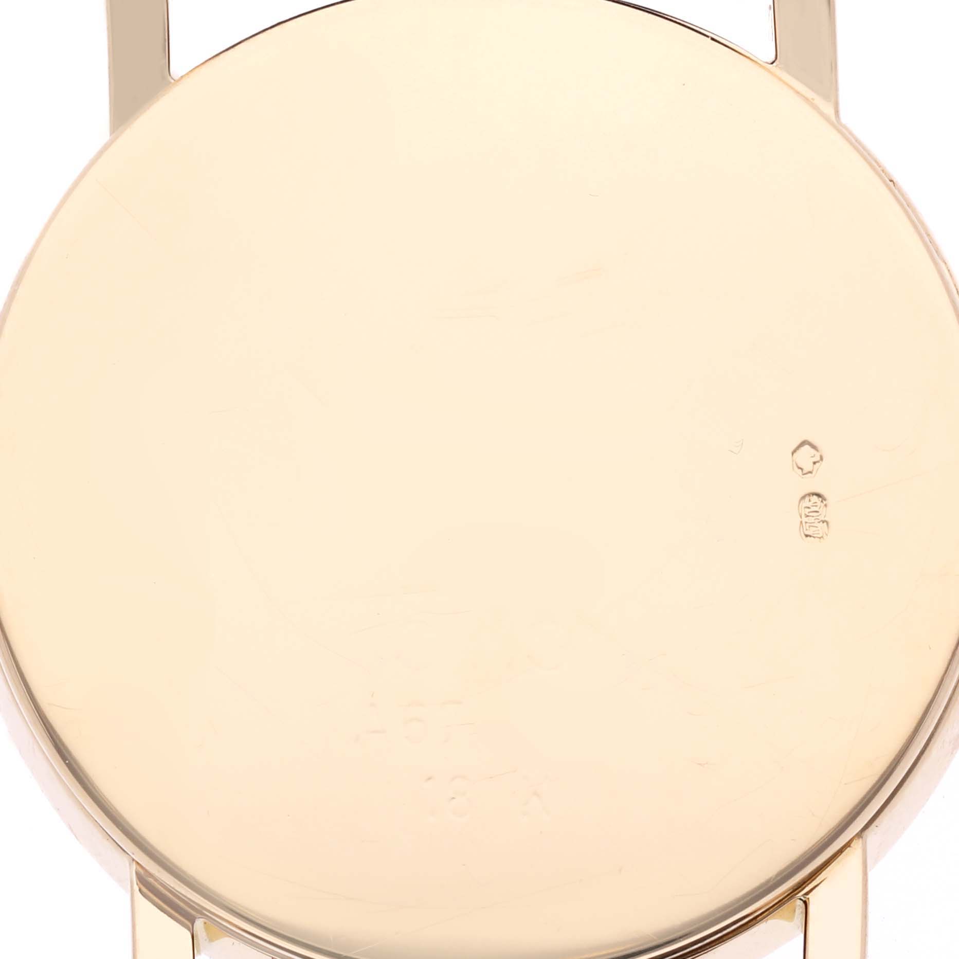 The image shows the back case of a Rolex Cellini 5115 Men's Yellow Gold Silver Dial 5115 Men's Yellow Gold Silver Dial watch, focused on its smooth, round surface.