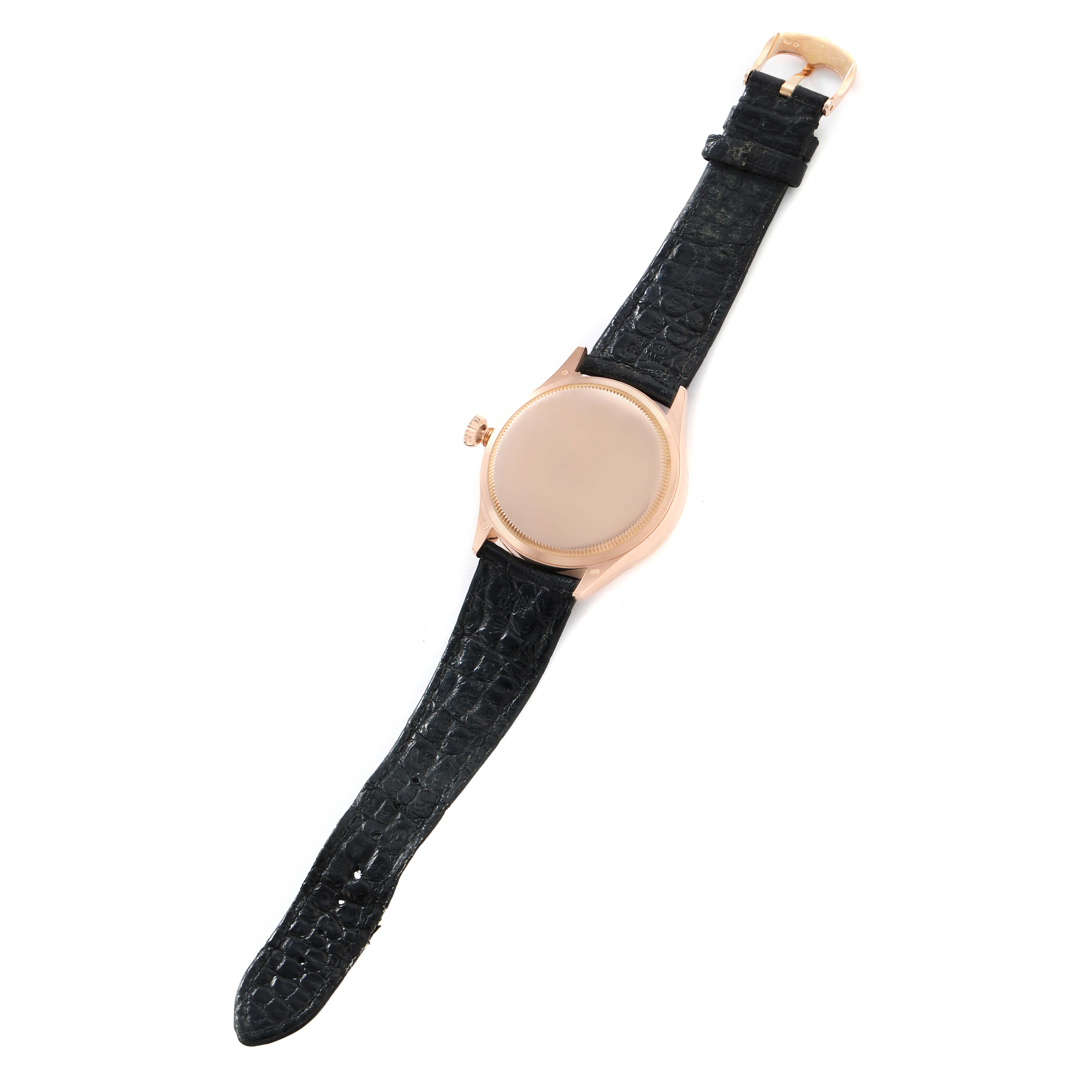 The image shows a Rolex Cellini 50515 Men
s Rose Gold Silver Dial watch from the back, highlighting the case, crown, and black leather strap.