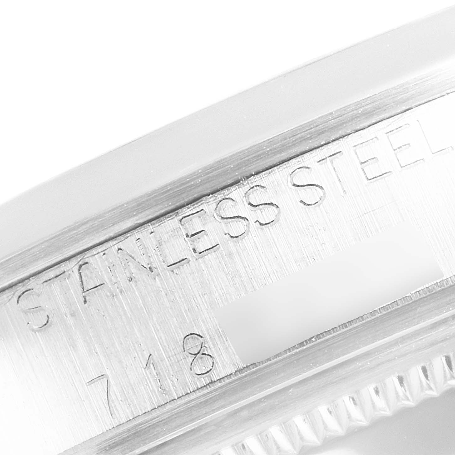 The image shows a close-up of the side of the Vintage Collection Rolex watch, highlighting the "STAINLESS STEEL" engraving.