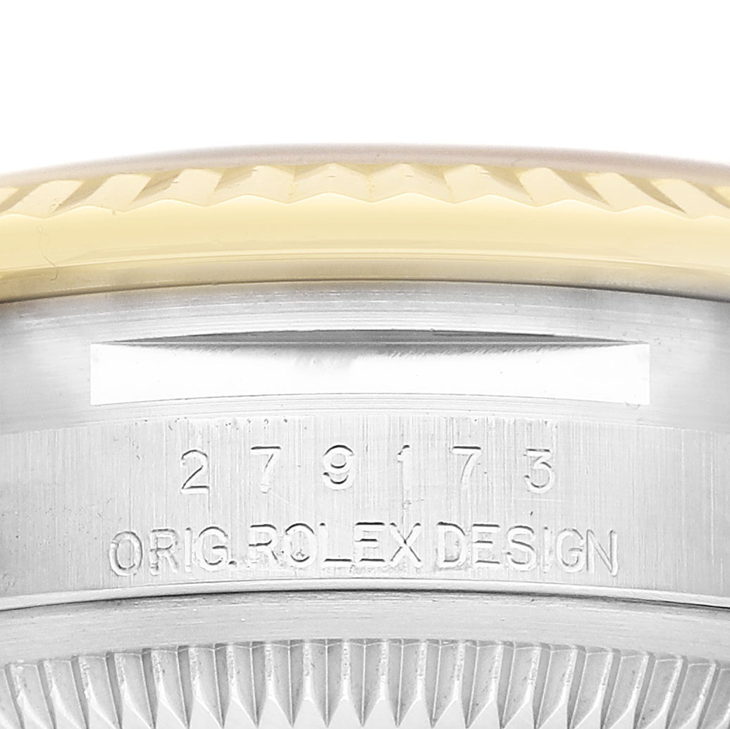 The image shows a close-up of the side of a Rolex Datejust 279173 Women's Steel and Gold (two tone) Silver Dial watch, highlighting the case engraving and part of the bezel.