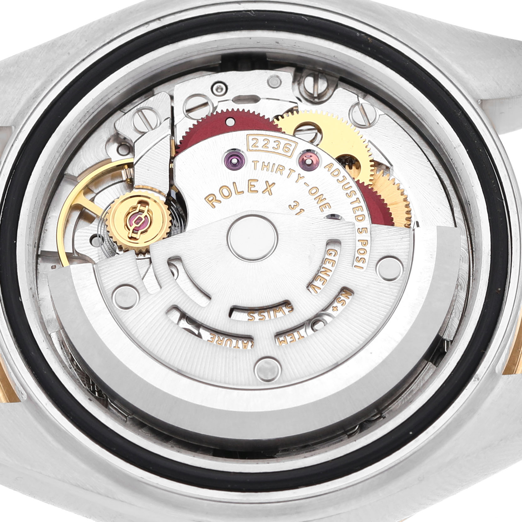 The image shows the movement mechanism of a Rolex Datejust 279173 Women's Steel and Gold (two tone) Silver Dial watch from a rear view angle, highlighting gears and inscriptions.